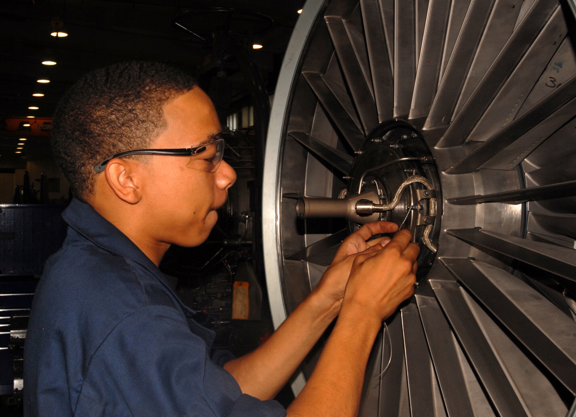 Airman Basic Lemar Mayberry performs a quad N1 sensor build-up on an F-15C  F100-PW-220E engine at Kadena Air Base Sept. 11, 2007.  Airman Mayberry works in the aerospace propulsion flight in the 18th Component Maintenance Squadron.  (U.S. Air Force photo/Airman 1st Class Ryan Ivacic)