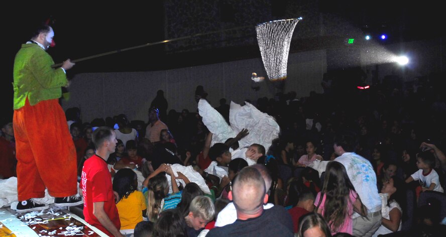 Aga-Boom performer holds a net as the audience throws pieces of paper into it near the end of show at Kadena Air Base, Japan, Sept. 7, 2007.