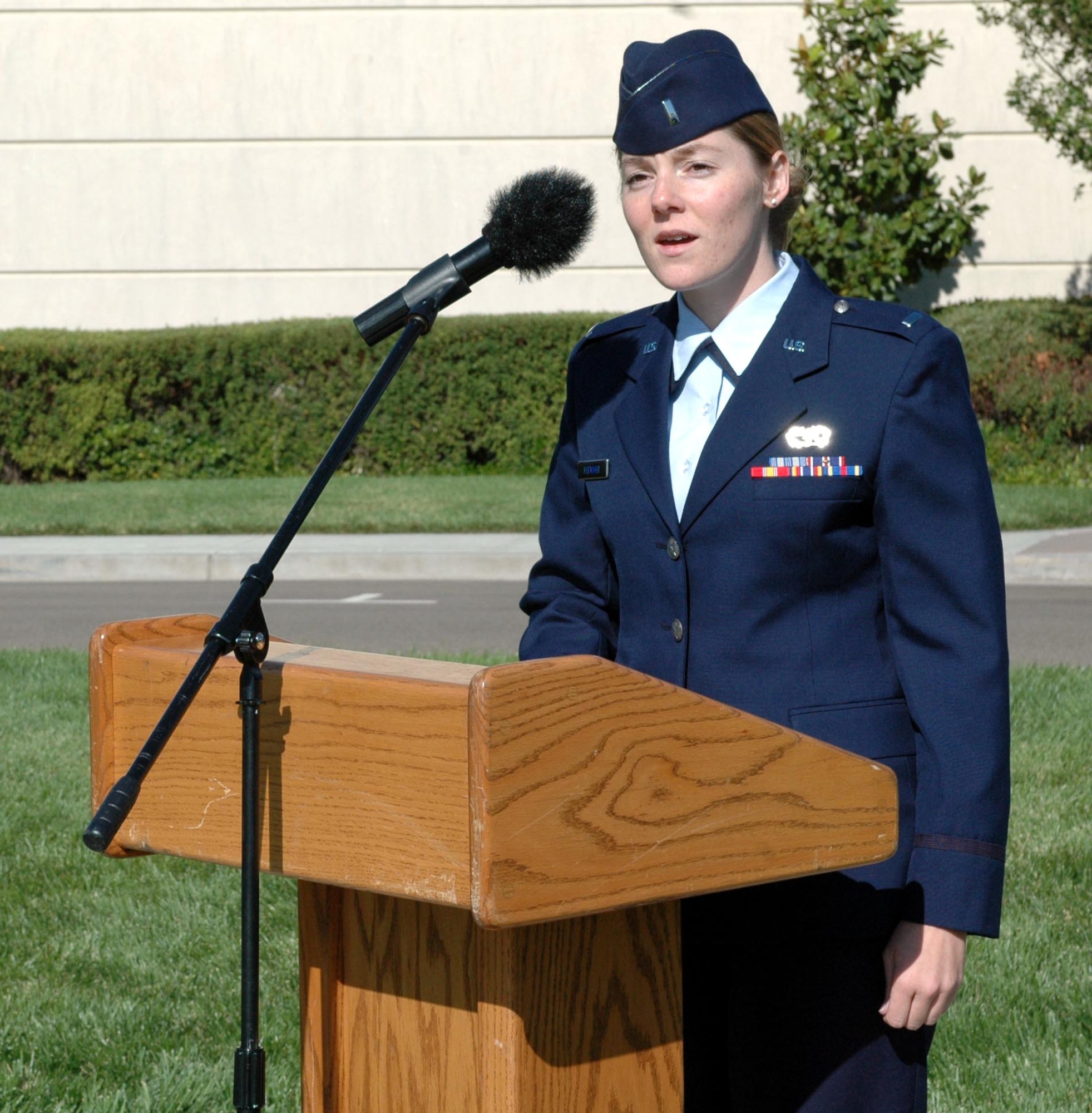 1st Lt. Meghann Fletcher, 60th Mission Support Group, performs a rendition of "America the Beautiful," during Team Travis' Sept. 11 Remembrance ceremony and retreat. (U.S. Air Force photo/Staff Sgt. Candy Knight)