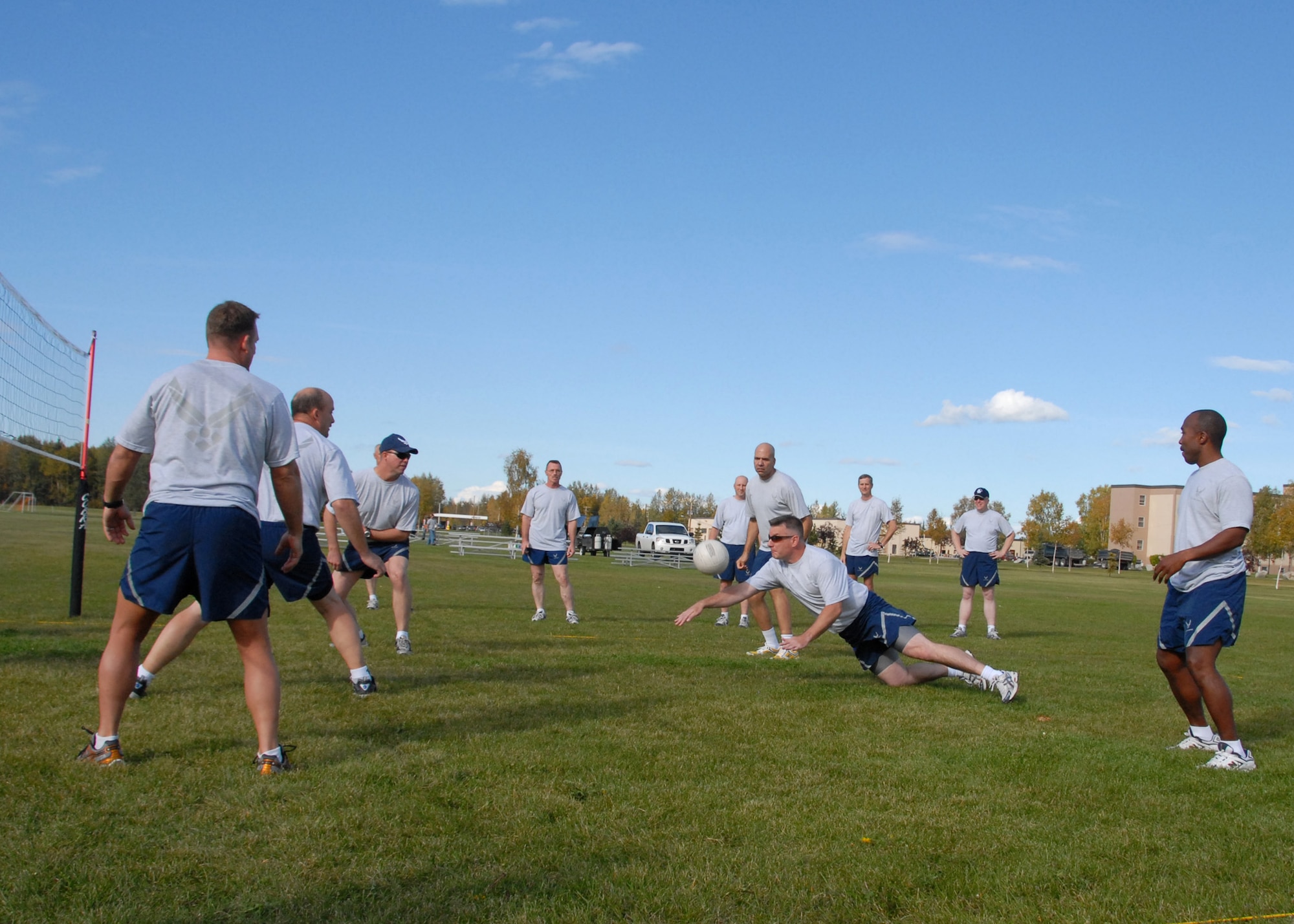 EIELSON AIR FORCE BASE, Alaska -- Chief Master Sgt. Stephen Ludwig, 354th Fighter Wing command chief, dives during a volleyball game against Airman Leadership School students Sept. 7 inbetween the dormitories. The Airman block party was hosted by Airman Committed to Excellence in efforts to raise morale on base before the long winter. The Chiefs went on to win all three games against the ALS students. (U.S. Air Force Photo by Airman 1st Class Jonathan Snyder) 