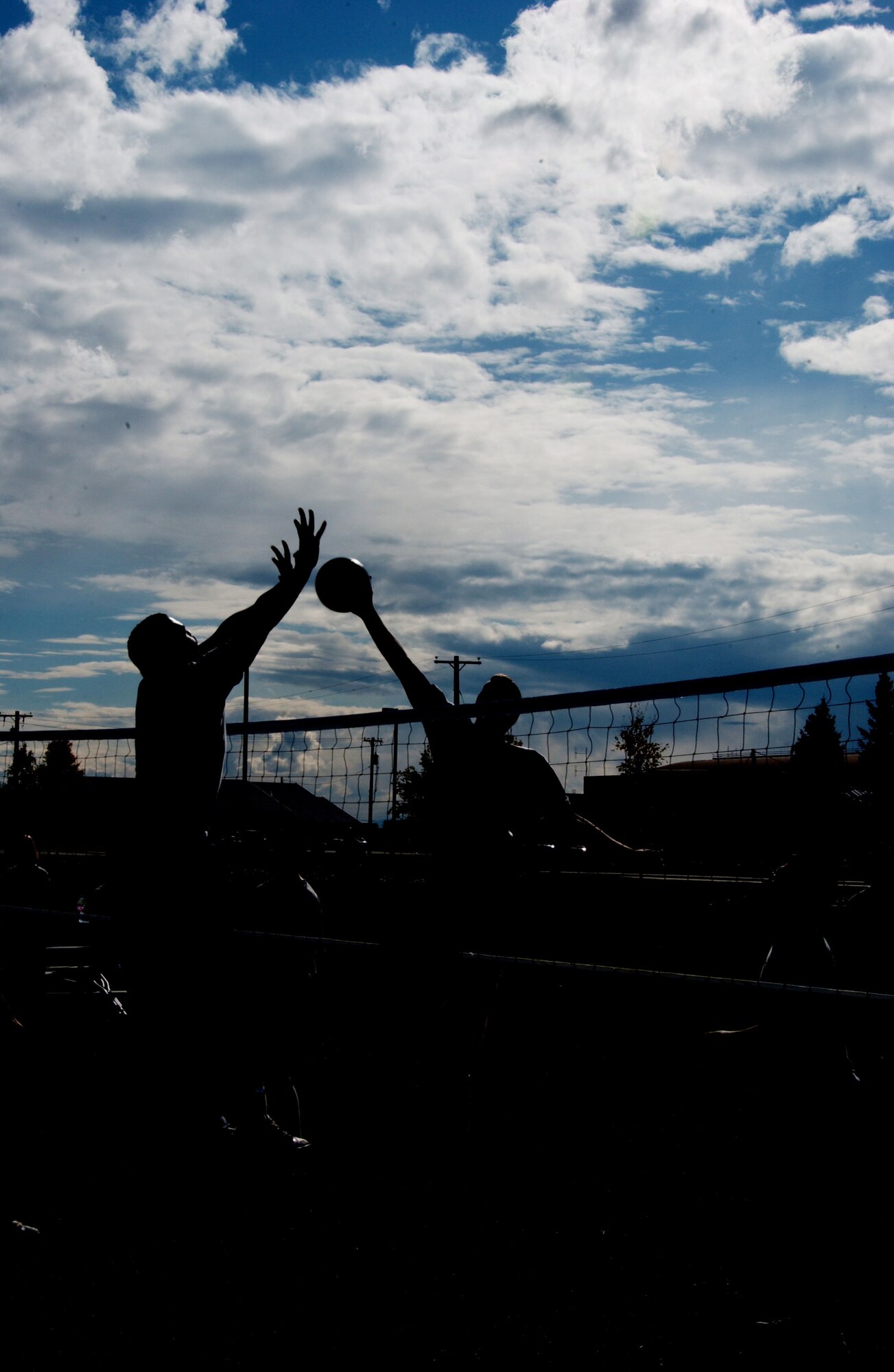 EIELSON AIR FORCE BASE, Alaska -- Airman Leadership School students face off against the Chiefs for a volleyball game Sept. 7 inbetween the dormitories. The Airman block party was hosted by Airman Committed to Excellence in efforts to raise morale on base before the long winter. The Chiefs went on to win all three games against the ALS students. (U.S. Air Force Photo by Airman 1st Class Jonathan Snyder) 