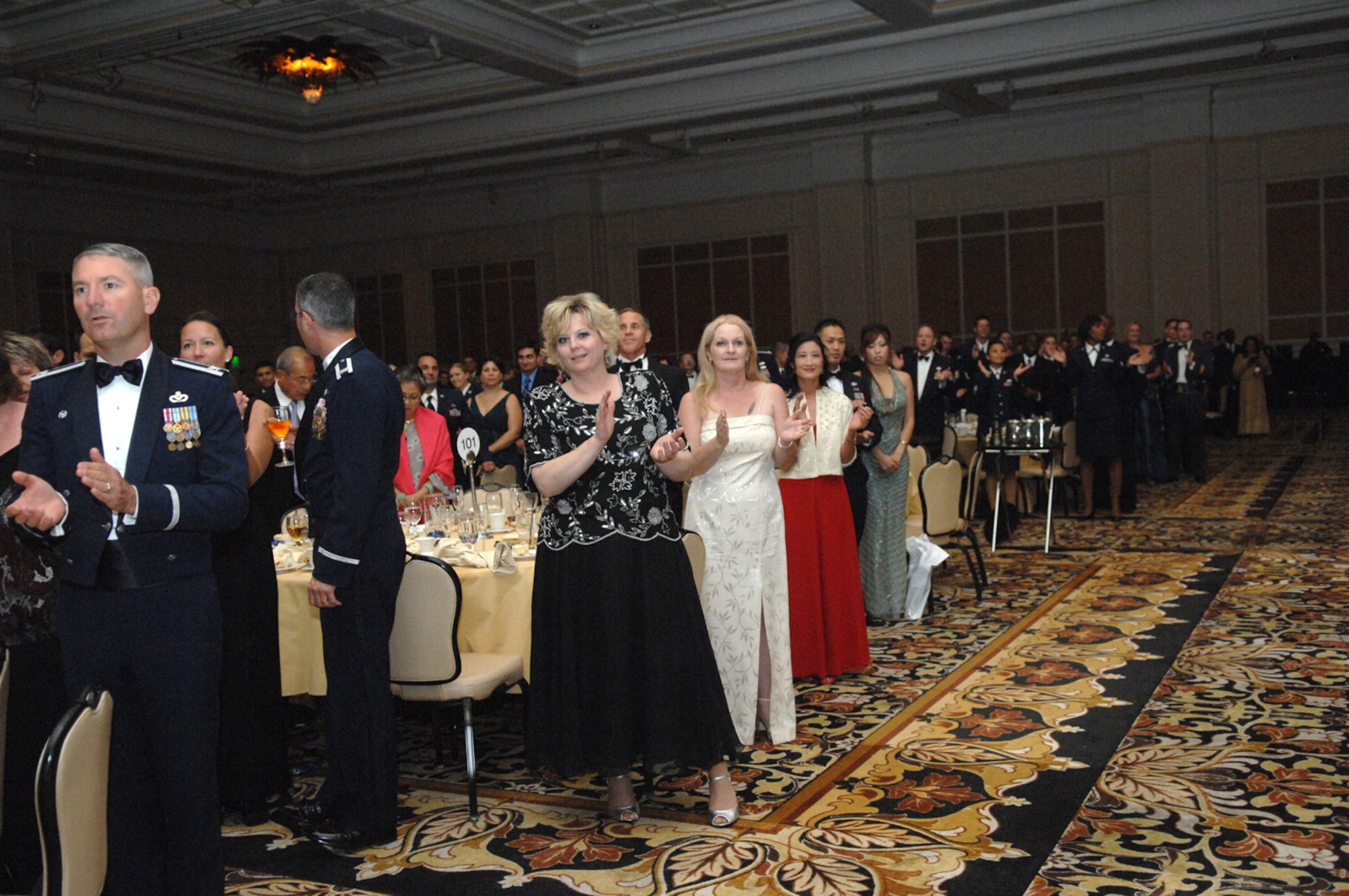 Attendees of the 60th Anniversary Air Force Ball clap during the singing of the Air Force song September 8, 2007 at the Mirage Hotel and Casino Las Vegas, NV.  More than 1,400 Airmen and guests attended the Ball, which held the theme "Heritage to Horizons.
(U.S. Air Force photo by Senior Airman Larry E. Reid Jr.)