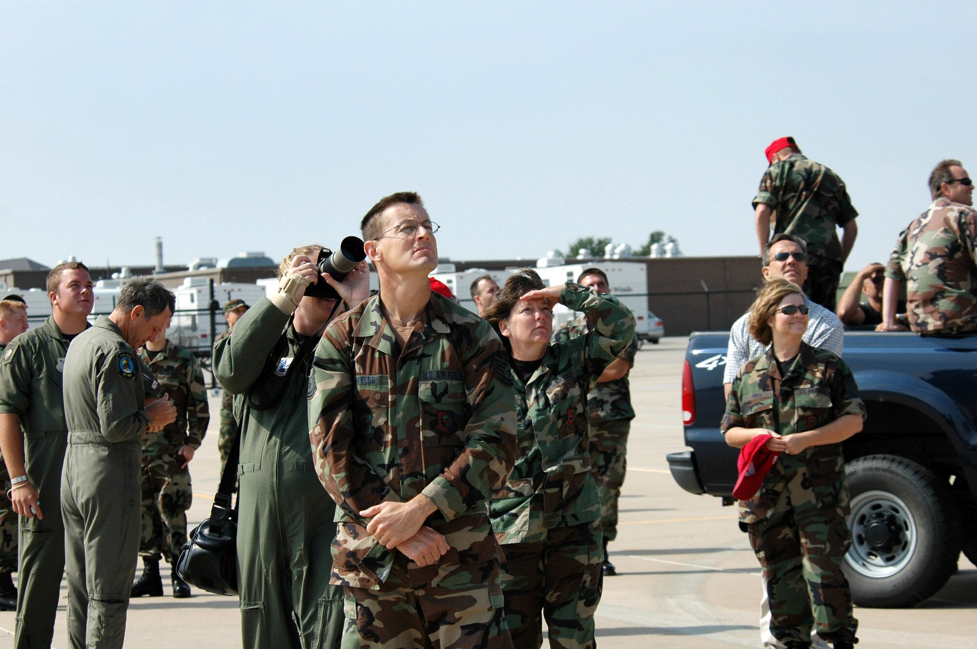 Tech. Sgt. Mike Shields watches in the foreground with other Kansas Air National Guardsmen as the final Kansas ANG KC-135 sortie departs Sept. 9 from McConnell Air Force Base, Kan. Sergeant Shields is a member of the 184th Maintenance Squadron. (U.S. Air Force photo/Master Sgt. Conrad Youngblom) 
