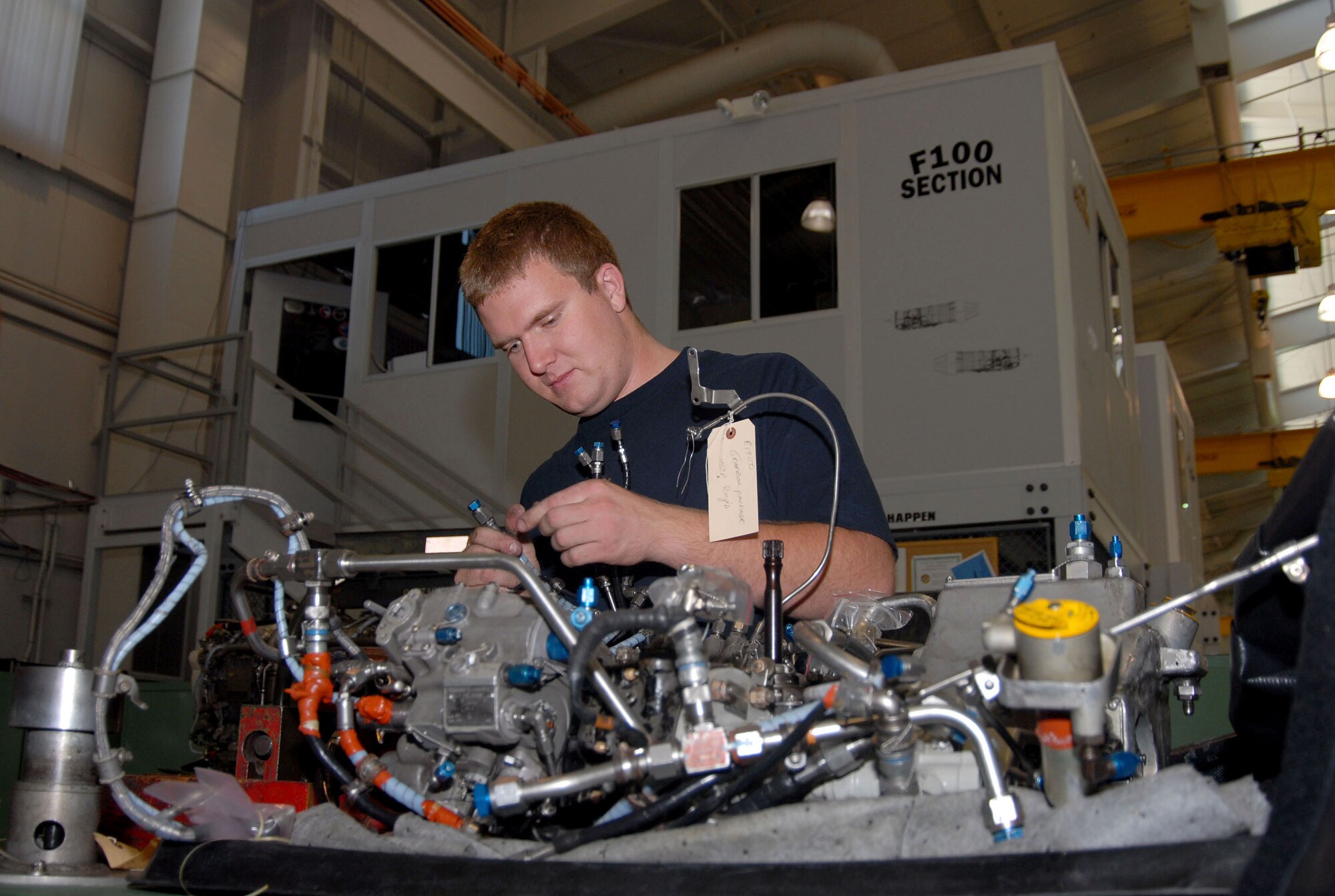 Michael Cermack works on aircraft engine components at the 412th Maintenance Squadron propulsion flight. Mr. Cermack was the first employee hired through a Co-Operative Education program organized between Antelope Valley College and Edwards. To be eligible, AVC students must have a 2.5 grade point average, be actively enrolled in the airframe powerplant program, be interviewed and show potential to handle the workload. (Photo by Senior Airman Jason Hernandez)