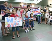 Friends and family members react to seeing their deployed Airmen heading toward them in the San Antonio International Airport. Twelve members of the 37th Security Forces Squadron from Lackland Air Force Base, Texas, returned home Sept. 4, 2007, after being delpoyed for six months in support of Operation Enduring Freedom. (USAF photo by Robbin Cresswell)