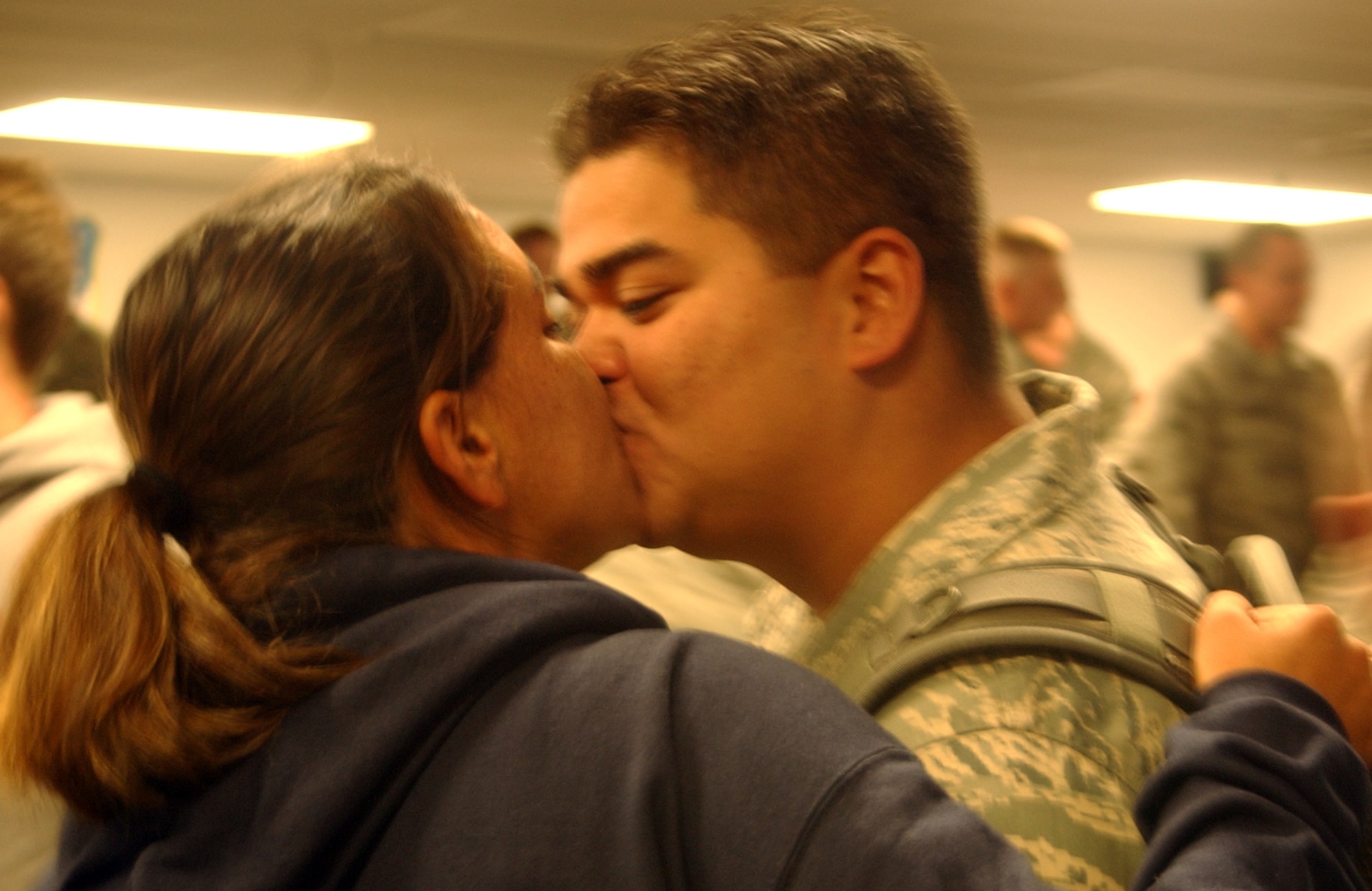 A member of the 819th RED HORSE Squadron gives his wife one last kiss goodbye before departing building 3080 for Holman Aviation and the awaiting aircraft. Nearly 200 members of the squadron left Sept. 11 for a six-month deployment to southwest Asia in support of the Global War on Terrorism. (U.S. Air Force photo/Valerie Mullett)                               
