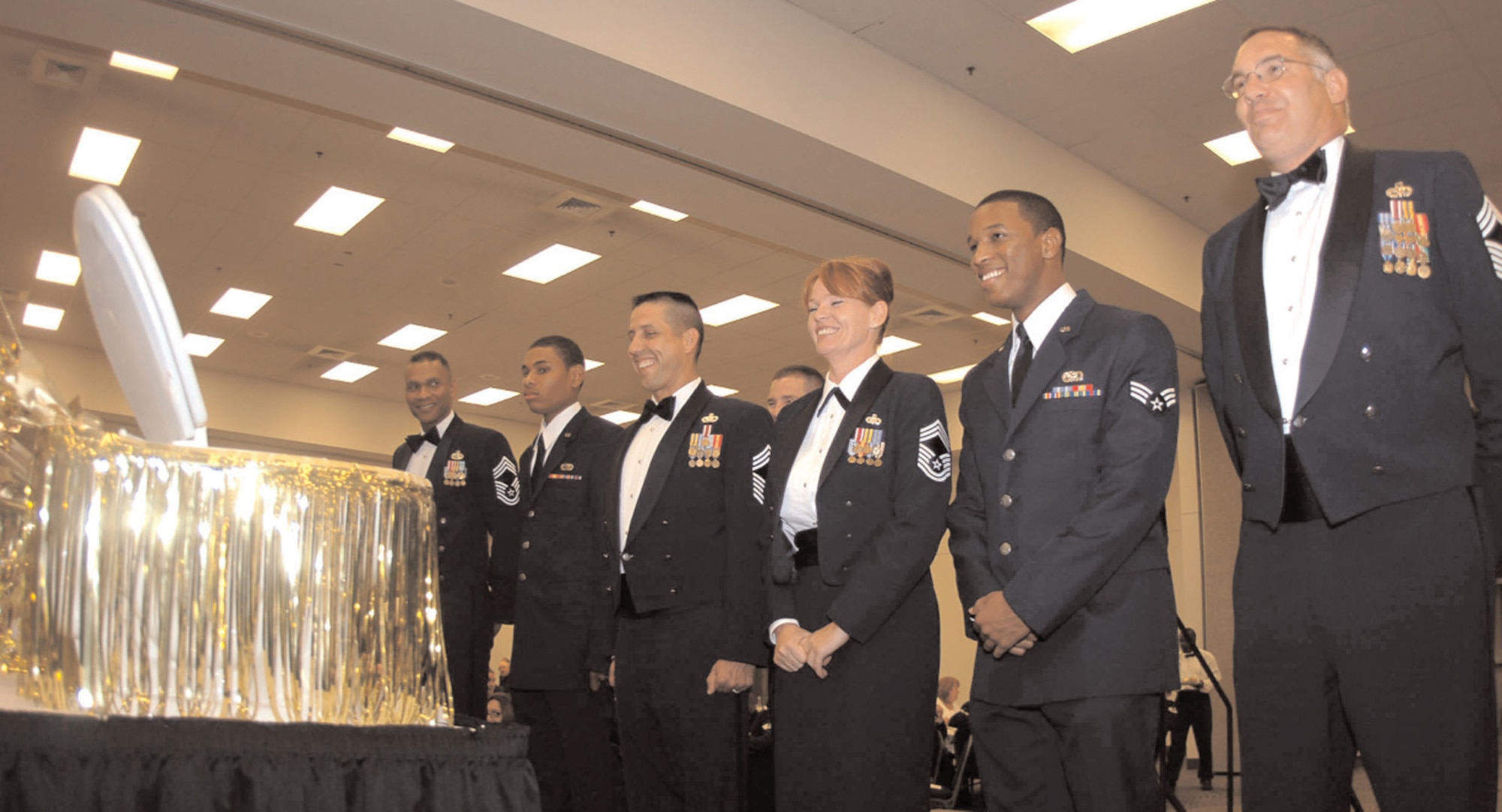 Members of the 7th Bomb Wing prepare to partake of the
grog for violating rules of the mess during the 23rd Annual Dining Out September 2006. (U.S. Air Force photo by Airman 1st Class Domonique Simmons)