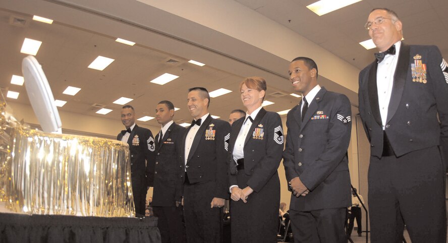 Members of the 7th Bomb Wing prepare to partake of thegrog for violating rules of the mess during the 23rd Annual Dining Out September 2006. (U.S. Air Force photo by Airman 1st Class Domonique Simmons)