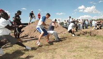 Members of the 90th Security Forces Squadron and the 90th Operations Support Squadron battle during a Tug-of-War match Aug. 24 (Photo by Airman Alex Martinez).