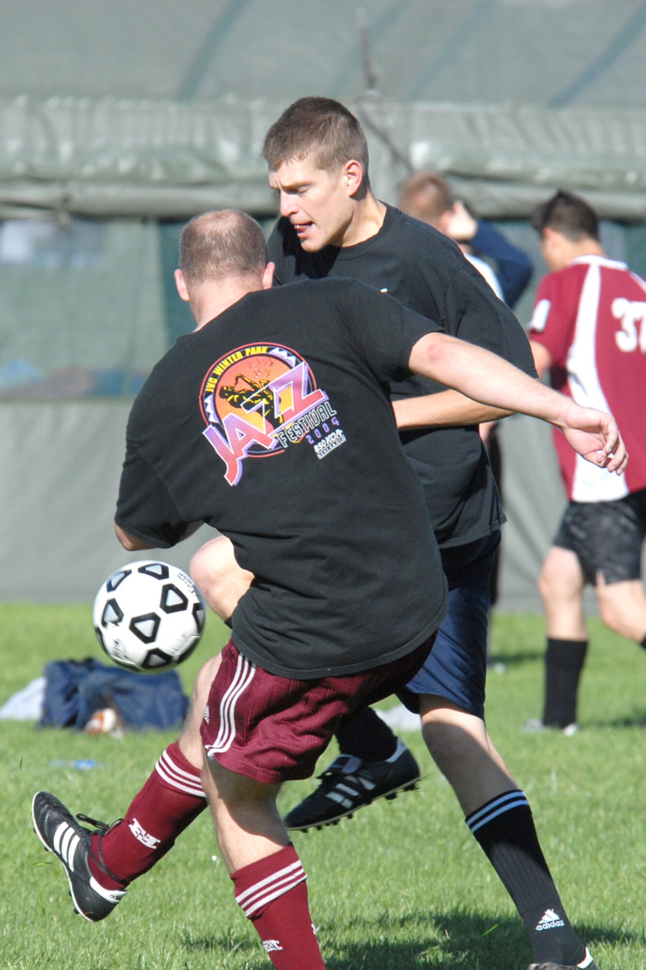 First Lt. Jonathan Walker, 90th Operations Support Squadron, defends the ball during a soccer game (Photo by Shelley Raffl).