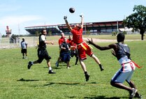 Airman Branden Peterson, 90th Security Forces Squadron, reaches for the ball during the Warren Pigskin Classic Aug. 25. The games started at 10 a.m. and ended with a trophy ceremony at around 5 p.m (Photos by Airman 1st Class Daryl Knee).