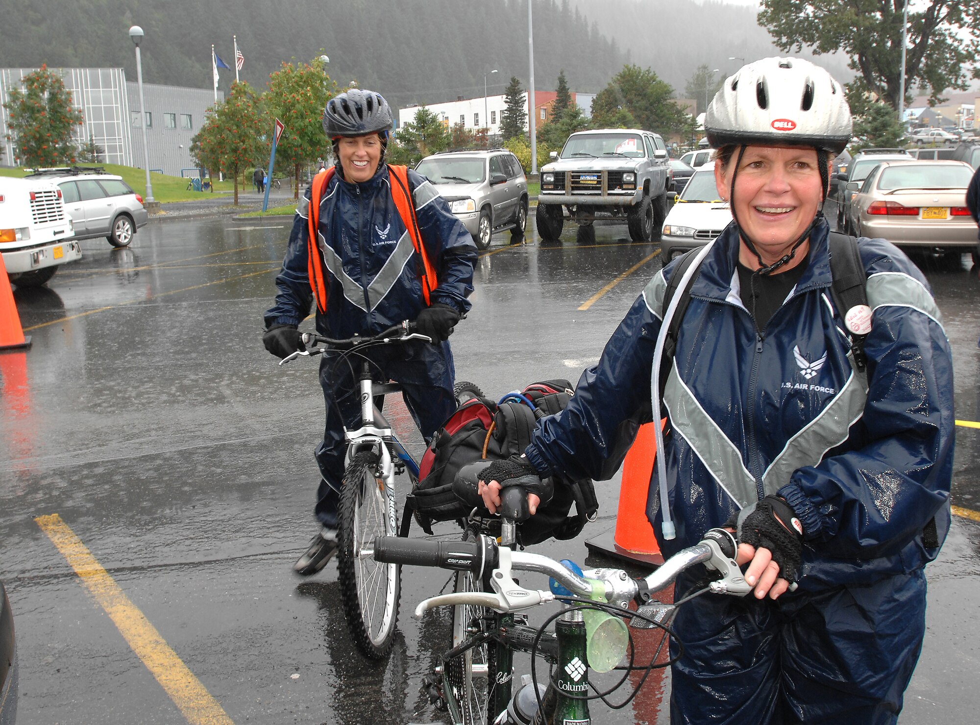 KENAI PENINSULA, ALASKA -- Maj. Julie Ostrand and Capt. Wendy Koehler arrive in Seward after completing the first leg of the Alaska MS Bike Ride. The ride took participants from Mile Post 63 on the peninsula along the Seward Highway to Seward, Alaska. Consistent and sometimes heavy rains didn't prevent Major Ostrand and Captain Koehler, both nurse practitioners at the 3rd Medical Group, and other 'Arctic Warriors' from Elmendorf Air Force Base, from completing the ride, which took place Sept. 8 and 9. People who took the 126-mile round trip ride saw extreme elevation gains challenging even the most experienced of the 200 riders. All proceeds from this event raised money for the Nation Multiple Sclerosis Society. (U.S. Air Force photo by Tech. Sgt. Keith Brown)