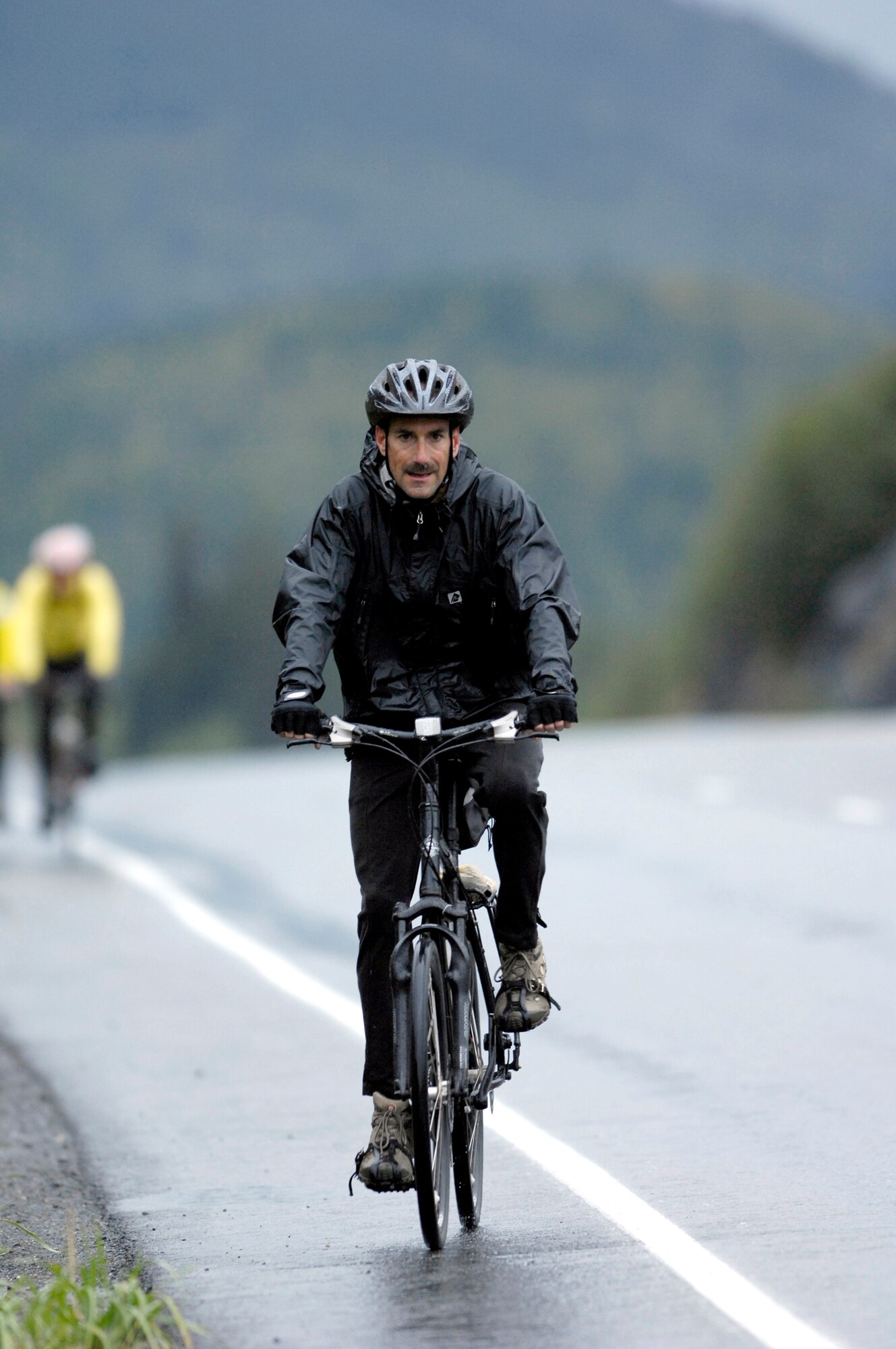 KENAI PENINSULA, ALASKA -- Chief Master Sgt. Jay Wilson participates in the Alaska MS Bike Ride along a section of the Seward Highway. Consistent and sometimes heavy rains didn't prevent Chief Wilson, a member of the 703rd Aircraft Maintenance Squadron, or other 'Arctic Warriors' from Elmendorf Air Force Base, from completing the ride, which took place Sept. 8 and 9. People who took the 126-mile round trip ride saw extreme elevation gains challenging even the most experienced of the 200 riders. All proceeds from this event raised money for the Nation Multiple Sclerosis Society. (U.S. Air Force photo by Tech. Sgt. Keith Brown)