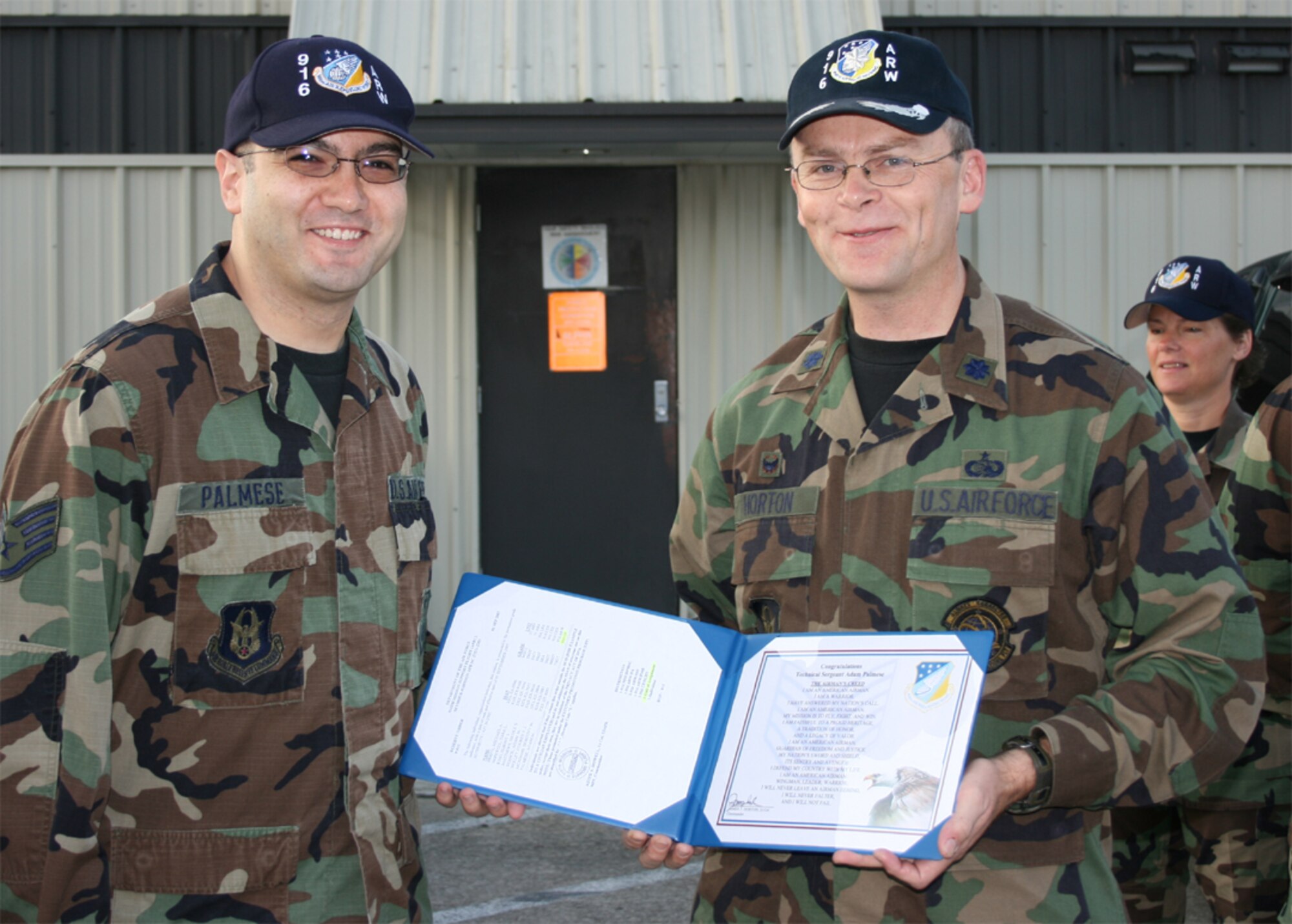 SEYMOUR JOHNSON AIR FORCE BASE, N.C. -- Tech. Sgt. Adam Palmese (left) was promoted during the September unit training assembly and presented the honor by his squadron commander, Lt. Col. James Horton. Sergeant Palmese is a Reservist with the 916th Communication Squadron and deployed for more than four months to Southwest Asia earlier this year.