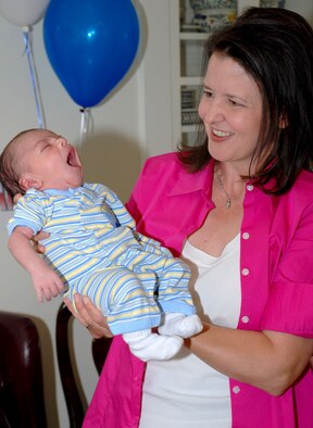 Rhonda Piccolo holds her adopted son, Joseph Alan during a baby shower Aug. 19. The Piccolo’s adopted the child through Wyoming Children Society (Photo by Airman 1st Class Daryl Knee).