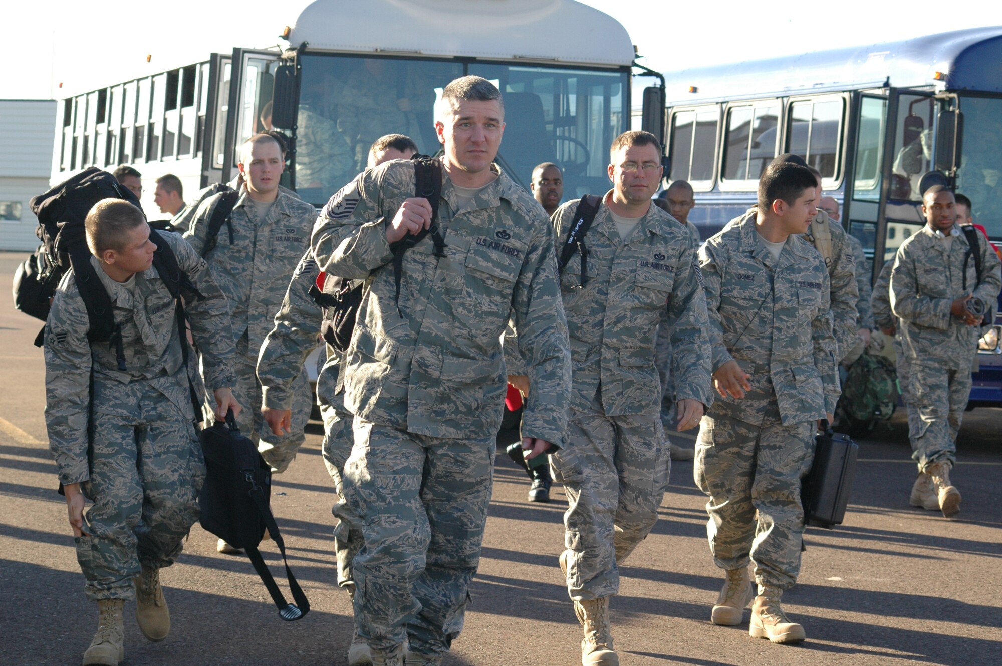 Members of the 819th RED HORSE Squadron prepare to board their plane Sept. 11 before a six-month deployment to southwest Asia in support of the Global War on Terrorism. (U.S. Air Force photo / Airman 1st Class Emerald Ralston)