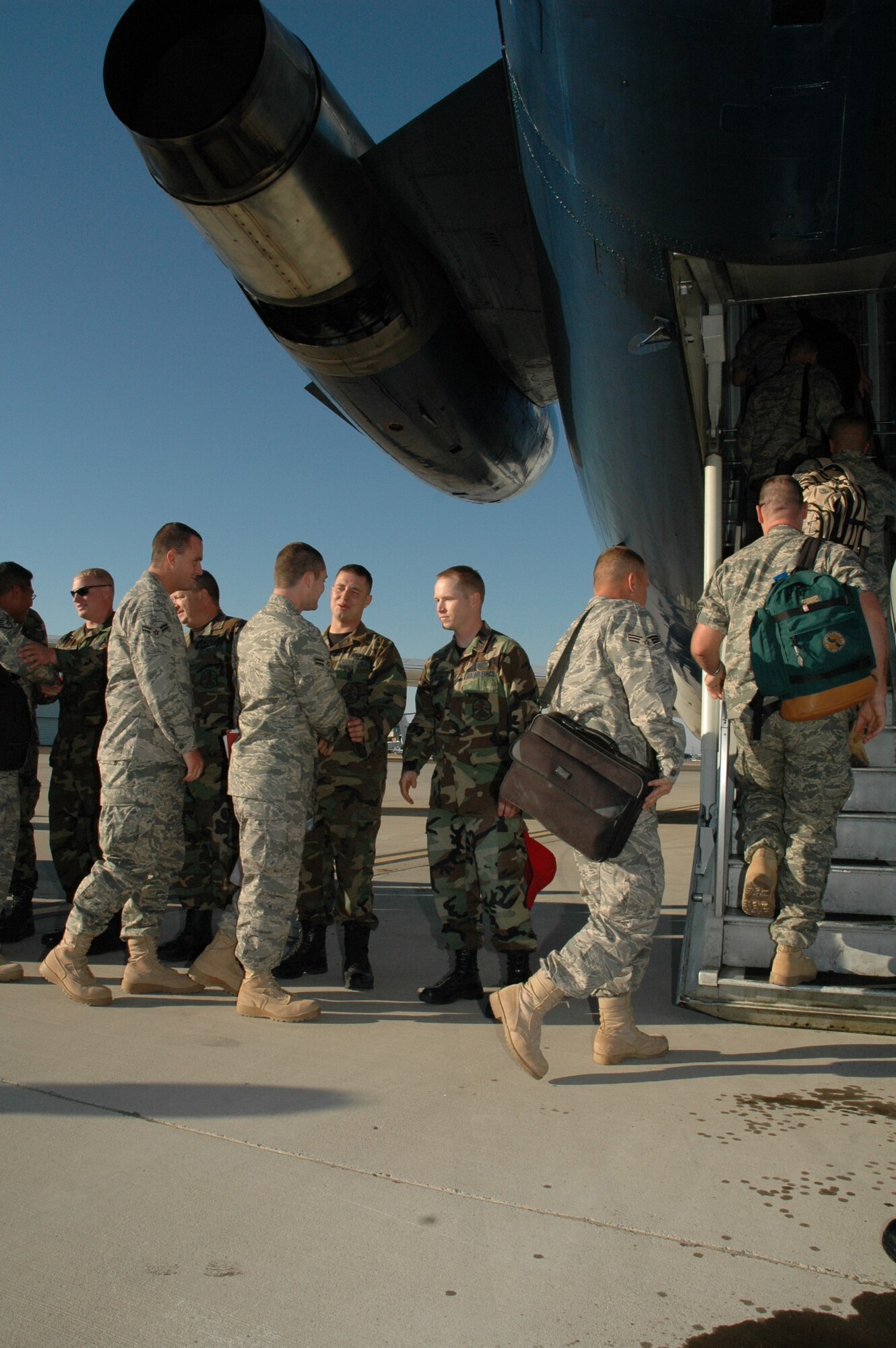 Members of the 819th RED HORSE Squadron board their plane Sept. 11 before a six-month deployment to southwest Asia in support of the Global War on Terrorism. Nearly 200 members of Malmstrom's 819th RHS will be serving in this deployment. (U.S. Air Force photo / Airman 1st Class Emerald Ralston)