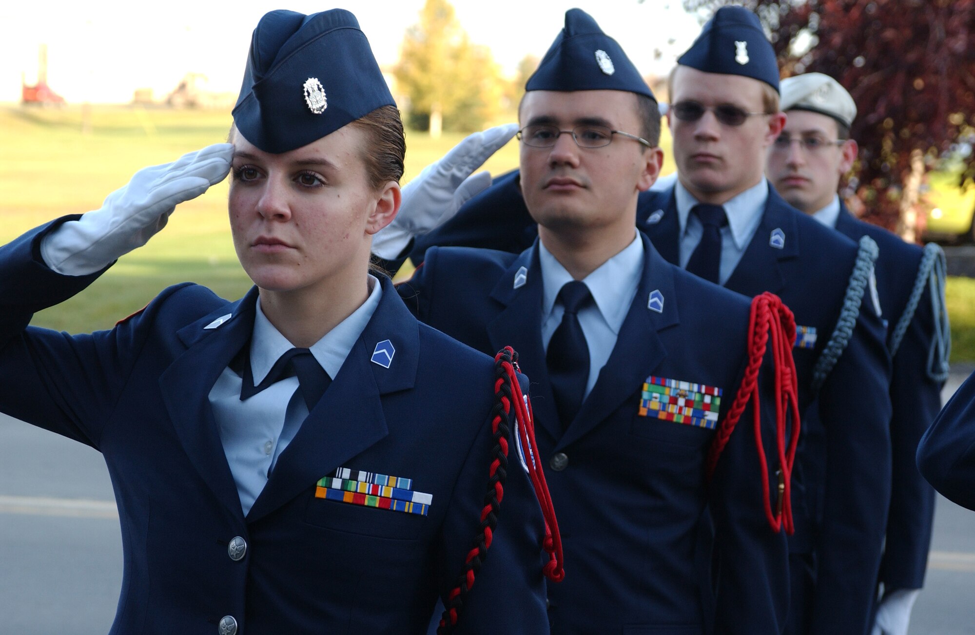 EIELSON AIR FORCE BASE, Alaska--Cadets salute the flag as it is being raised up the flag pole during the Sept. 11 reveille ceremony infront of Amber Hall. Ben Eielson Junior Reserve Officer Training Corps cadets perform an annual reveille ceremony, this one highlighting the anniversary of the Sept. 11 attack on the U.S. (U.S. Air Force photo by Airman 1st Class Nora Anton)                                                                      