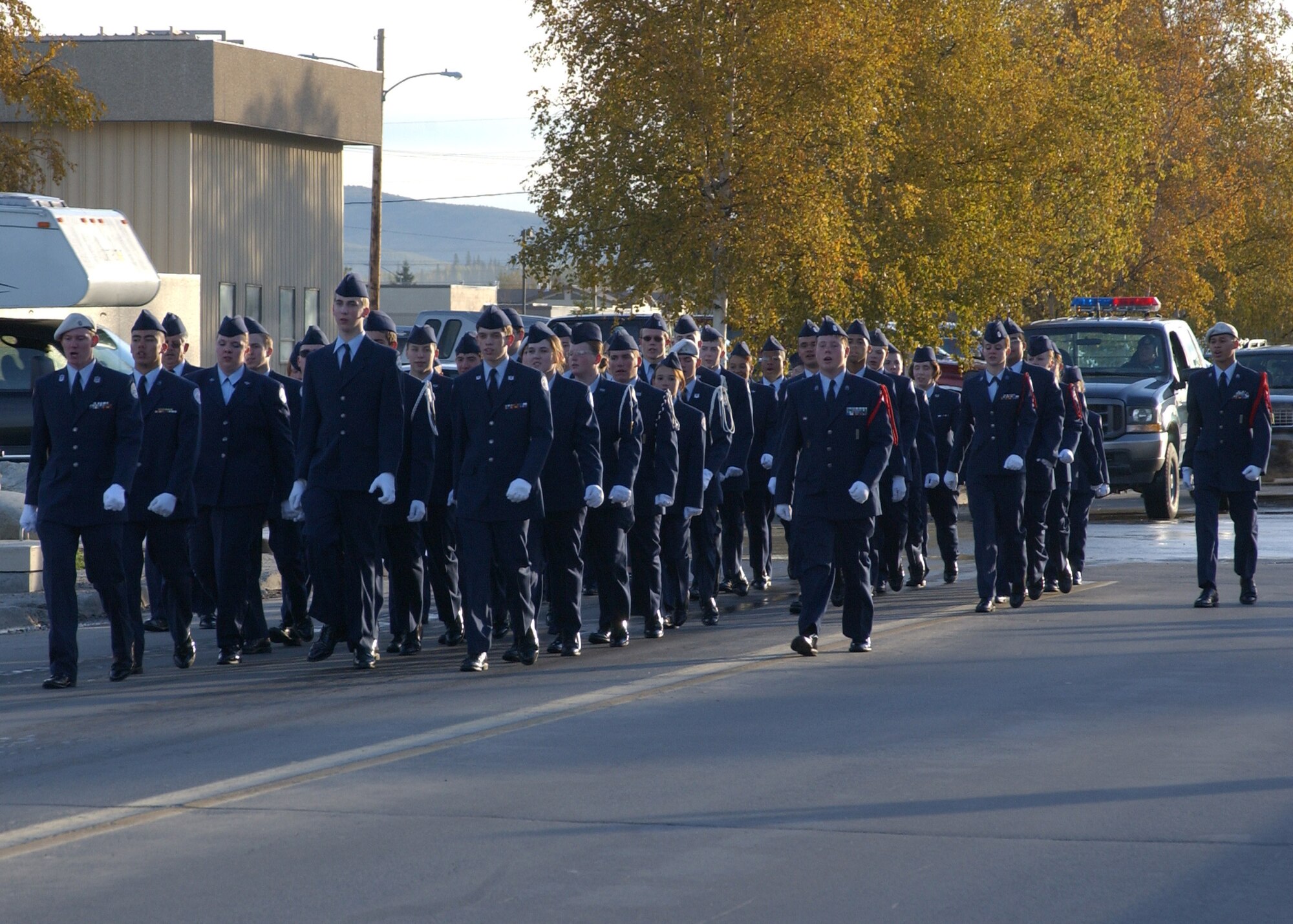 EIELSON AIR FORCE BASE, Alaska--Cadets of the Ben Eielson Junior Reserve Officer Training Corps march from Ben Eielson High School to Amber Hall Sept. 11 to perform a reveille ceremony. Ben Eielson JROTC cadets perform an annual reveille ceremony, this one highlighting the anniversary of the Sept. 11 attack on the U.S. (U.S. Air Force photo by Airman 1st Class Nora Anton)                                       