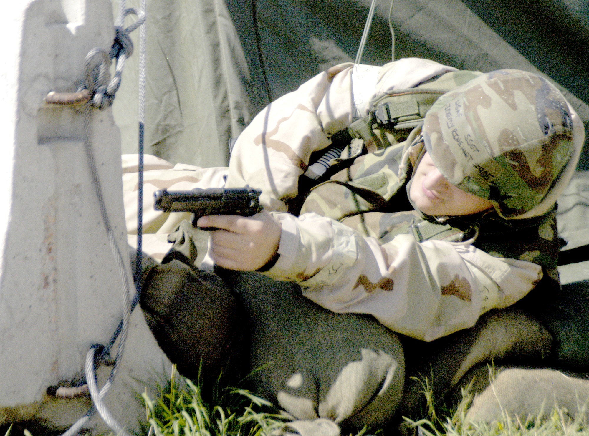 Staff Sgt. Jeremy Rinehart, 90th Comptroller Squadron, mans a defensive fighting position after receiving word that simulated snipers were seen on the camp’s perimeter during the exercise Aug. 17 (Photo by Airman Alex Martinez).