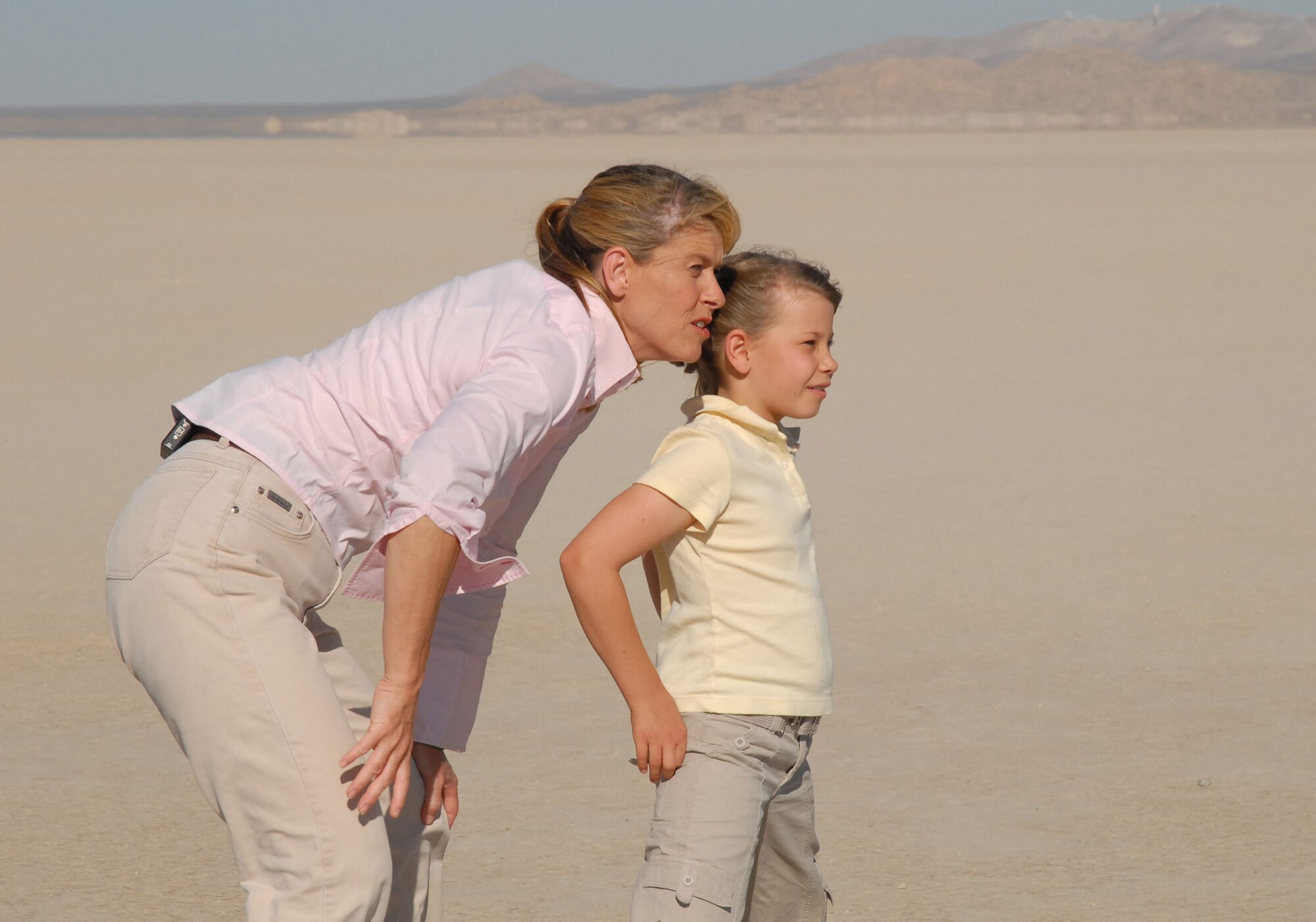 EDWARDS AIR FORCE BASE, Calif. -- Terri and Bindi Irwin gaze across the Rogers Dry Lake here after watching a C-17 Globemaster approach the flightline. Terri and Bindi visited Edwards on Sept. 6 to film a segment for their television show "Bindi the Jungle Girl." (Photo by Airman 1st Class Stacy Sanchez)