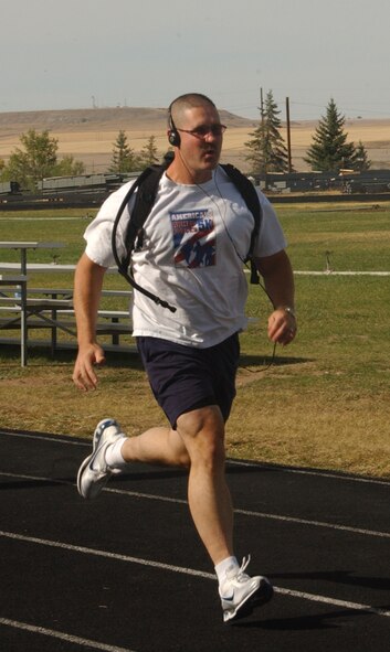 Master Sgt. Jimmy Jackson, 341st Logistics Readiness Squadron first sergeant, mixes a combination of walk, jog, lunge and sprint as part of his regular training regiment in preparation for Saturday's Air Force Marathon. (U.S. Air Force photo/Valerie Mullett)