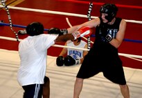 Second Lt. Derrick Burks, 90th Missile Security Forces Squadron (Right), and Senior Airman Kevin Johnson, 90th MSFS (Left), spar during a practice at Fall Hall Community Center Aug. 2. Both Airmen are members of the Warren boxing team and are preparing for an upcoming Inter-service Boxing Exhibition on Aug. 24 (Photos by Staff Sgt. Chad Thompson).