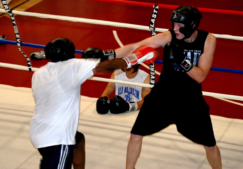 Second Lt. Derrick Burks, 90th Missile Security Forces Squadron (Right), and Senior Airman Kevin Johnson, 90th MSFS (Left), spar during a practice at Fall Hall Community Center Aug. 2. Both Airmen are members of the Warren boxing team and are preparing for an upcoming Inter-service Boxing Exhibition on Aug. 24 (Photos by Staff Sgt. Chad Thompson).