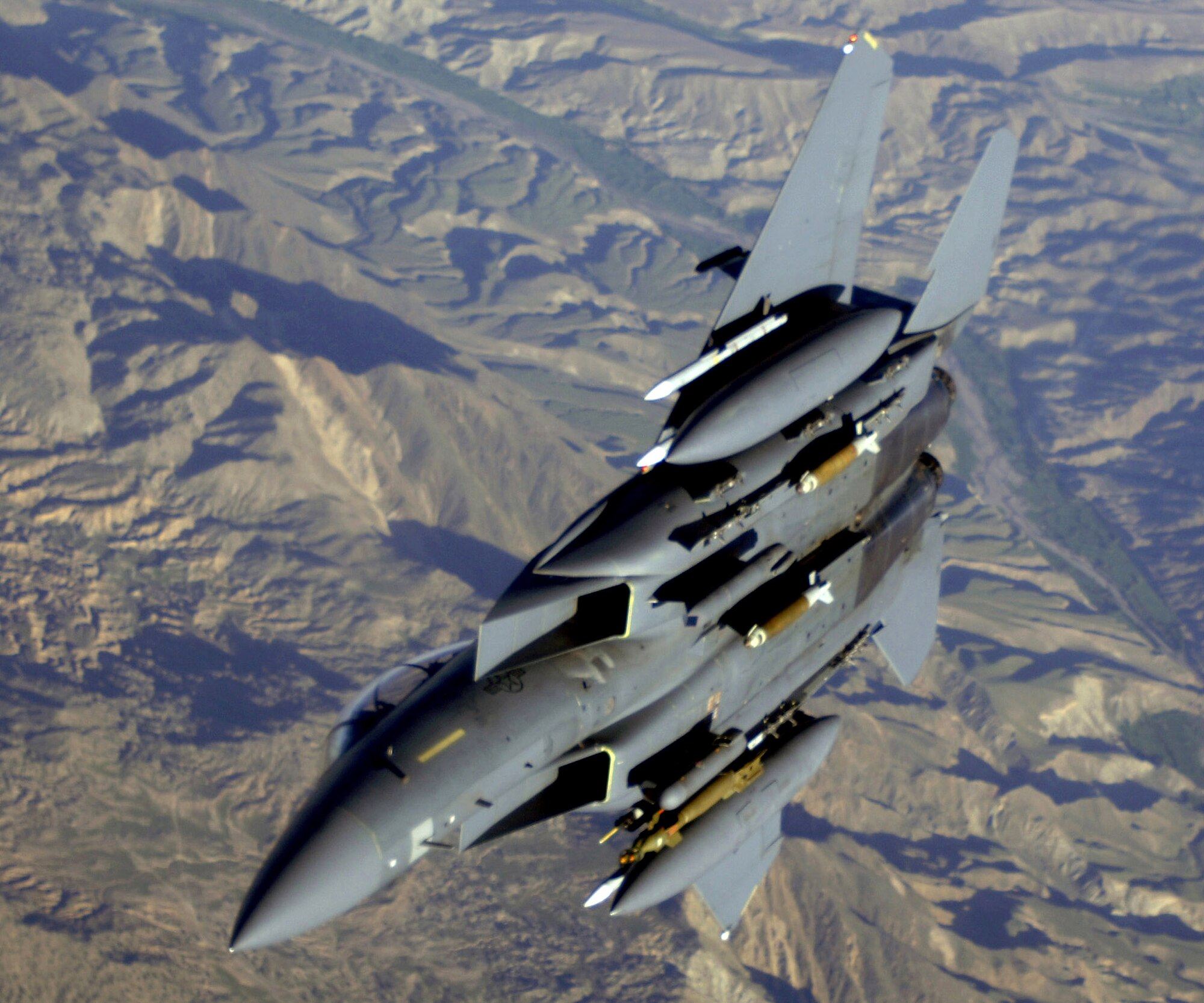 An Air Force F-15E Strike Eagle aircraft flies over Afghanistan. Air Force F-15, A-10 Thunderbolt II and B-52 Stratofortress aircraft are providing close-air support to troops on the ground engaged in rooting out insurgent sanctuaries and support networks. (U.S. Air Force photo/Master Sgt. Lance Cheung)