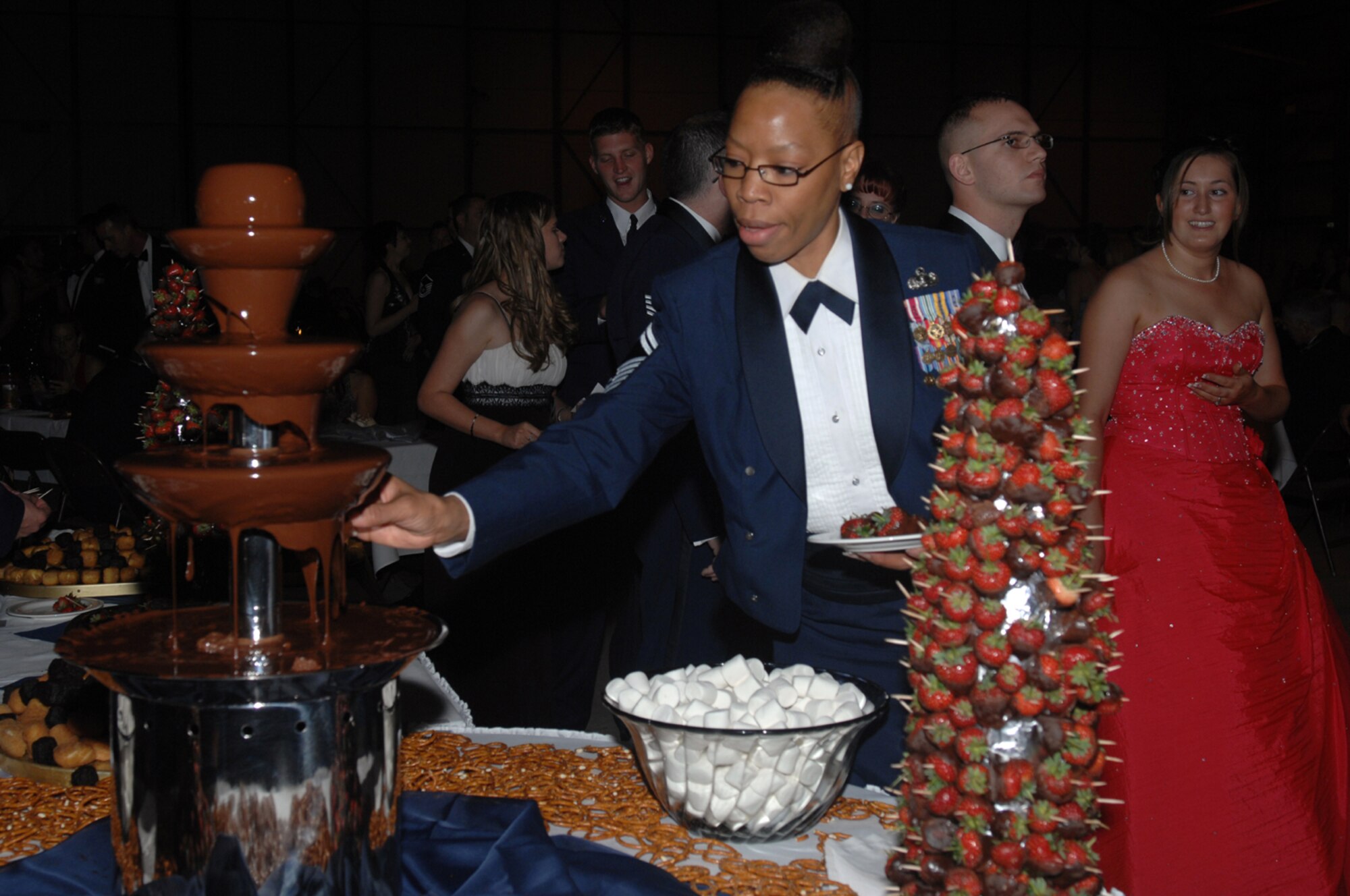 Senior Master Sgt. Tracy Goodwin, 48th Services Squadron, partakes of goodies during the 60th Anniversary Air Force ball at RAF Lakenheath Sept. 8. More than 500 Liberty warriors attended the event. (U.S. Air Force photo by Tech. Sgt. Sabrina Johnson)