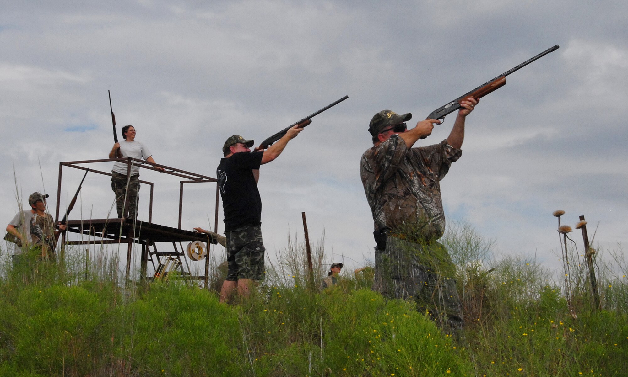 Two shooters get ready for a one, two shot Sept.  8 during a skeeting shooting competition at the Birdwell-Clark Ranch east of Henrietta, Texas. The ranch hosted its 3rd Annual Clay County Dove Hunt Salute to the Military, providing a free day of hunting and food for active-duty military and guests. Hunting dove was limited as very few were flying, but participants made up for not shooting dove by shooting clay pigeons. (U.S. Air Force photo/Mike Litteken)