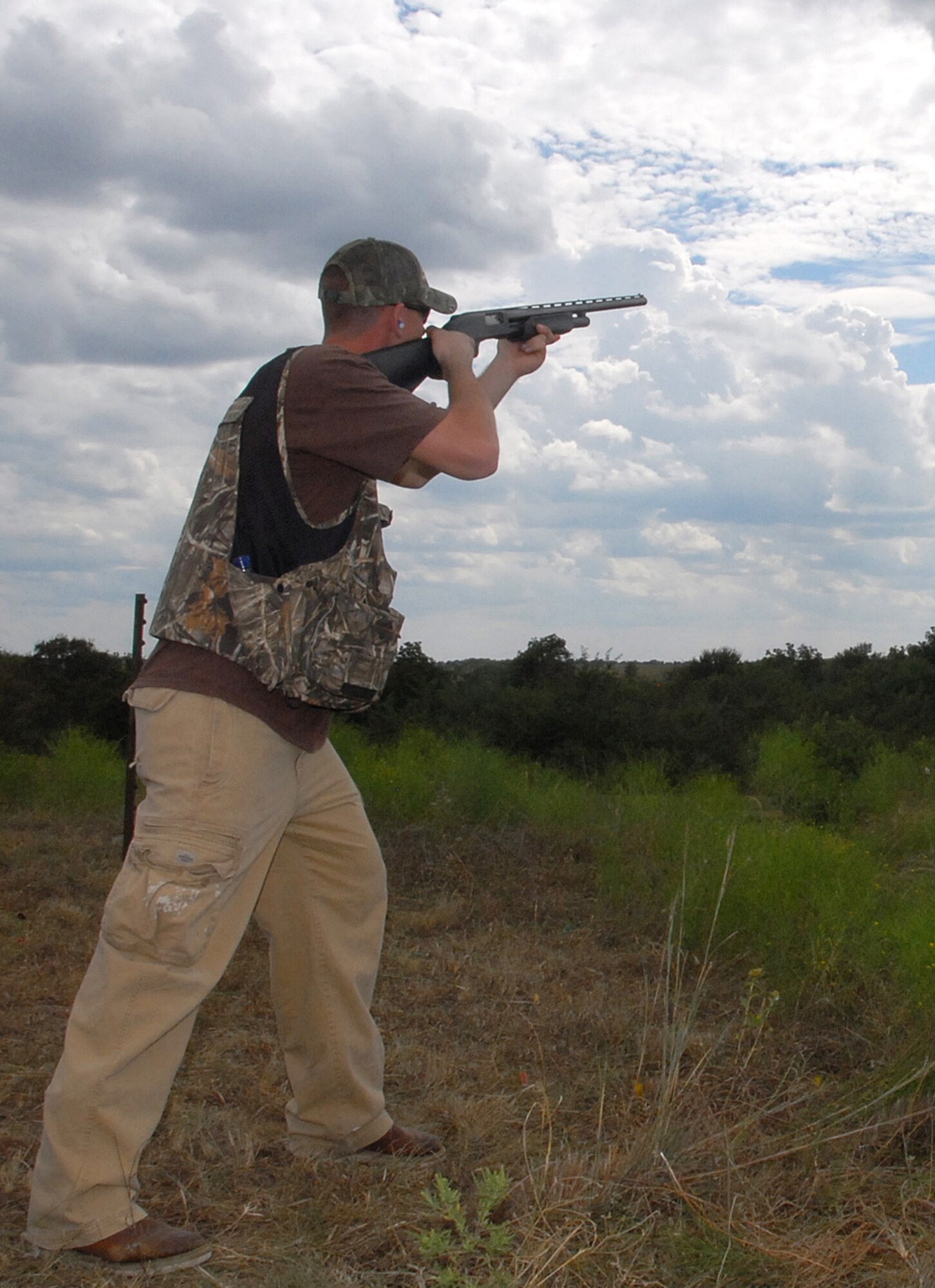 A shooter readys himself during a skeet shooting competition Sept. 8 at the 3rd Annual Clay County Dove Hunt Salute to the Military at the Birdwell-Clark Ranch east of Henrietta, Texas. The ranch played host to more than about 100 Sheppard members and treated them to a cookout. (U.S. Air Force photo/Mike Litteken)
