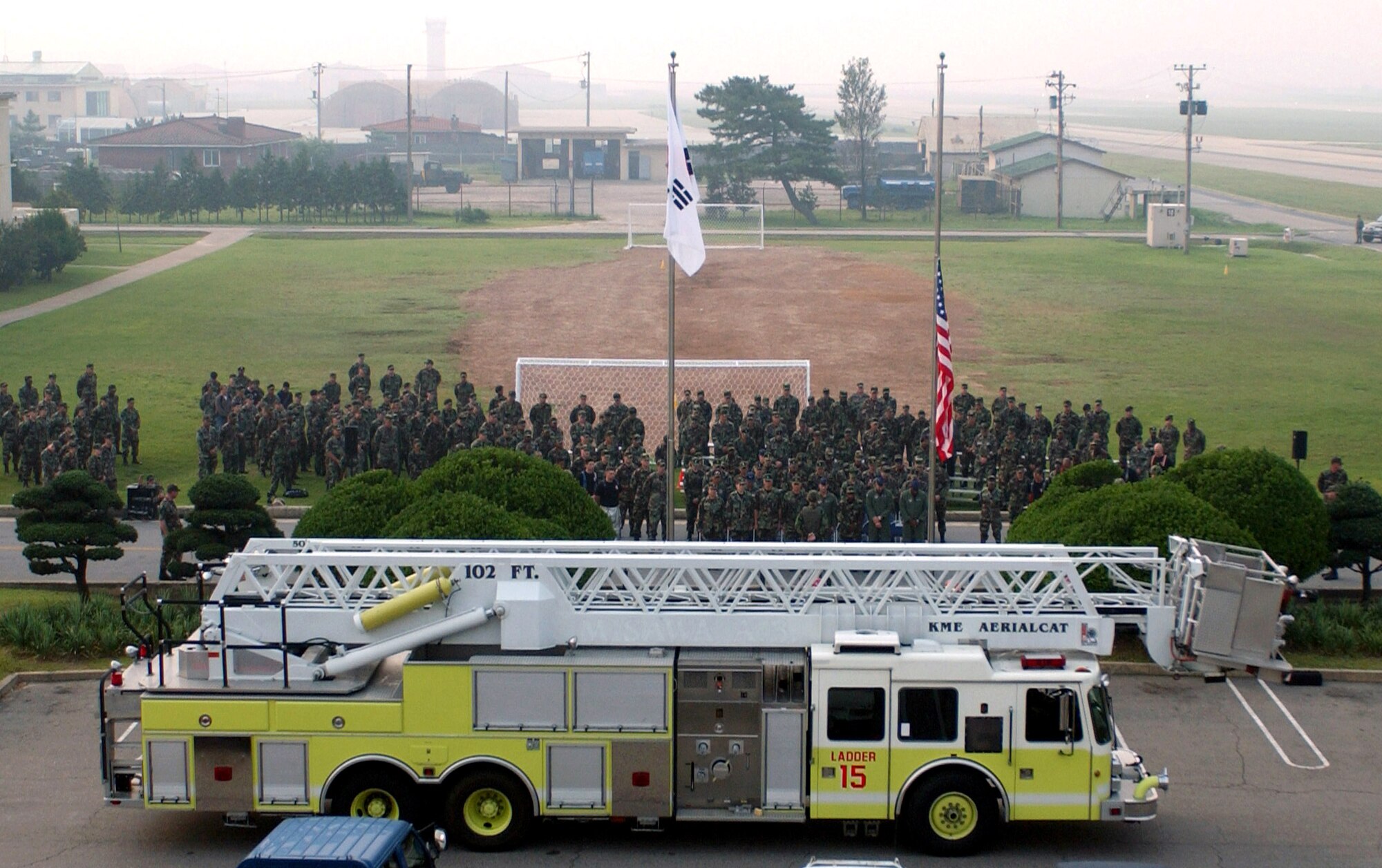 Airmen from the 8th Fighter Wing pause for a moment of silence during the Sept. 11, 2001, remembrance ceremony Sept. 11 at Kunsan Air Base, South Korea. The ceremony marked the sixth anniversary of the terrorist attacks in New York City, the Pentagon and Shanksville, Pa. (U.S. Air Force photo/Senior Airman Steven R. Doty)
