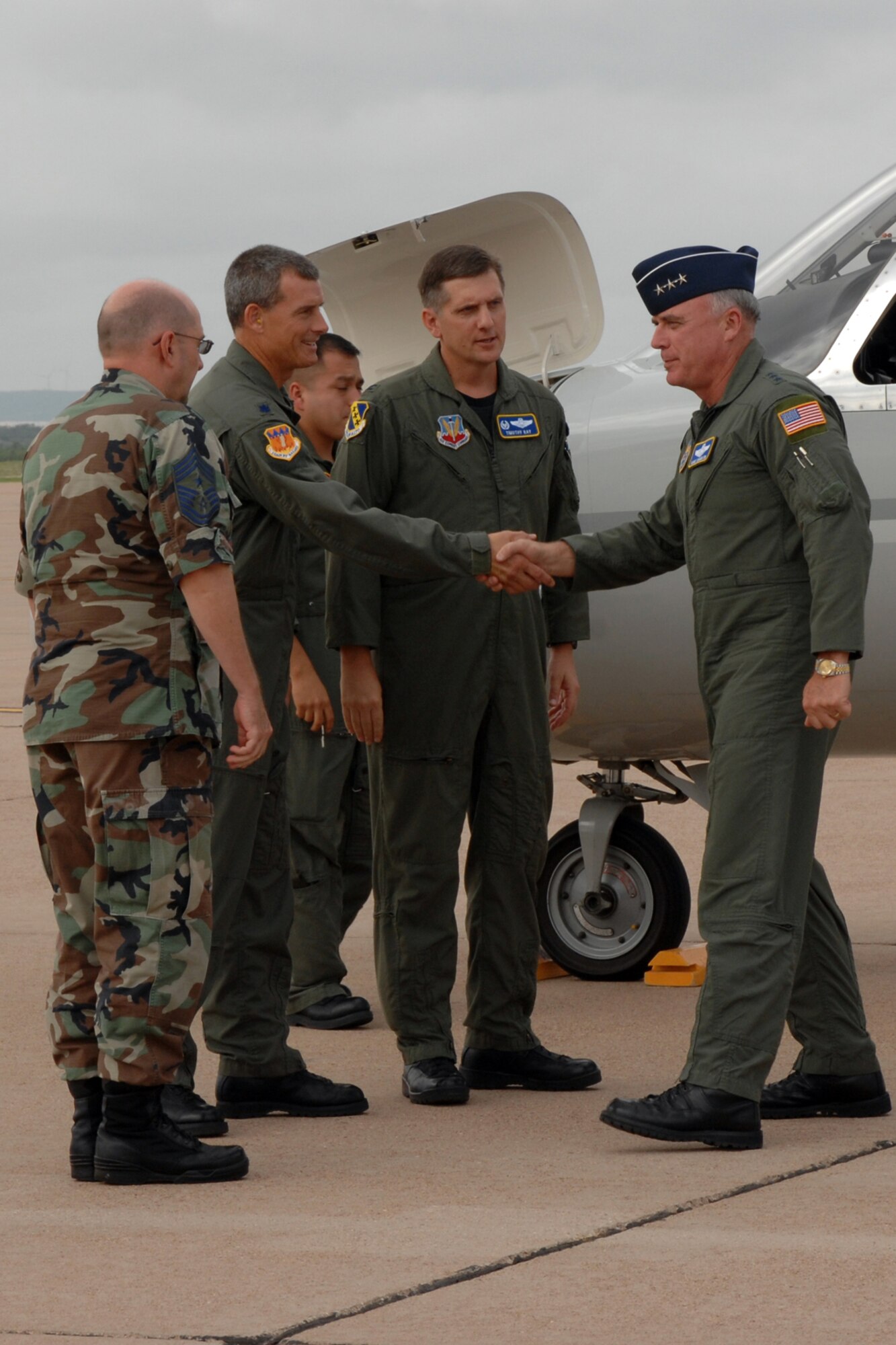 Dyess Air Force Base, Texas-- Lt. Gen. Howie Chandler, Deputy Chief of Staff for Operations, Plans and Requirements, Headquarters U.S. Air Force, Washington, D.C., is welcomed to Dyess by Col. Timothy Ray, 7th Bomb Wing commander, Lt.Col Jerry Goff, 317th Airlift Group deputy commander, and Chief Master Sgt. David Goldie, 7th BW command chief. General Chandler was given the opportunity to fly in a C-130 and B-1 during his visit here. (U.S. Air Force photo by SrA Courtney Garrard)