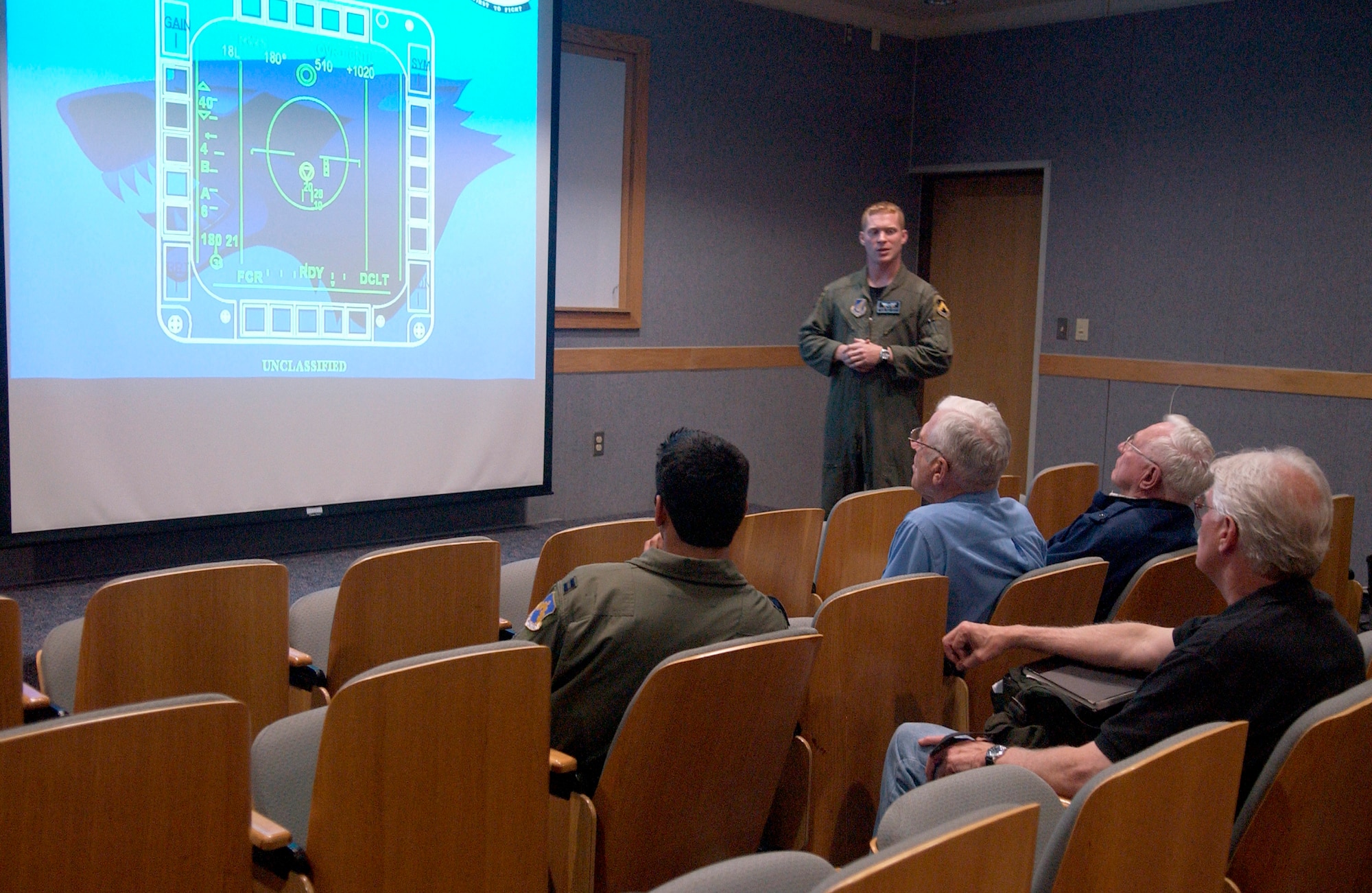 KUNSAN AIR BASE, South Korea - Captain Pat Kennedy, a pilot from the 35th Fighter Squadron, briefs Korean War veterans on flying sortie operations Sept. 11 here. The veterans from the Korean War era visited Kunsan where they shared their experience with 8th Fighter Wing Airmen.  (U.S. Air Force photo/Senior Airman Giang Nguyen)


