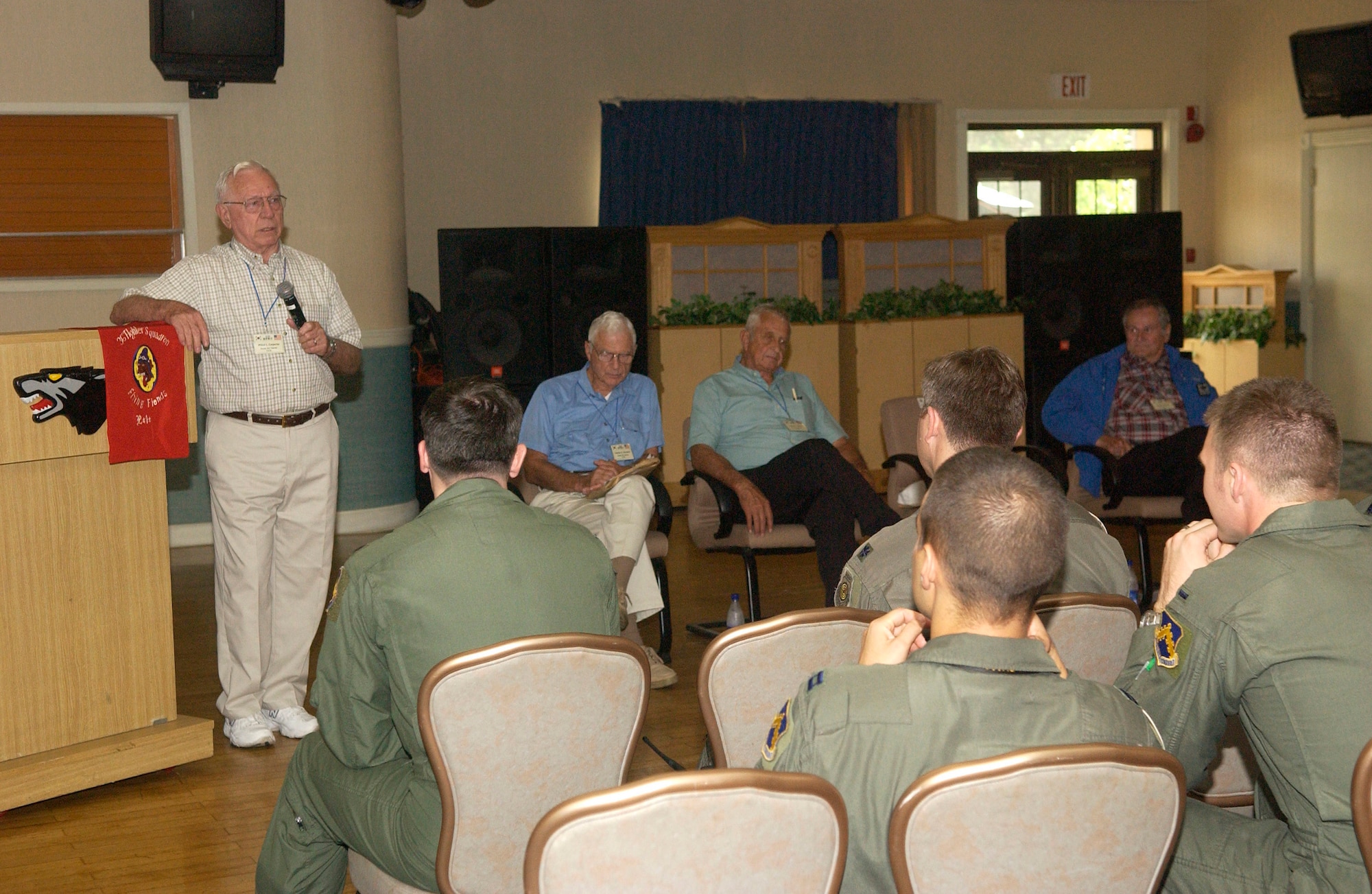 KUNSAN AIR BASE, South Korea - Retired Col. Wilbur Carpenter speaks to 8th Fighter Wing Airmen about his flying experience during the Korean War Sept. 11 here. The veterans from the Korean War era visited Kunsan where they shared their experience with 8th Fighter Wing Airmen. (U.S. Air Force photo/Senior Airman Giang Nguyen)