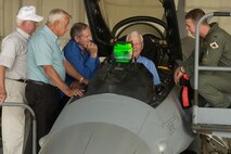 KUNSAN AIR BASE, South Korea - Captain Cesar Orozco, a pilot from the 35th Fighter Squadron, shows retired Lt. Gen. Charles Cleveland the functions of the F-16C Sept. 11. The veterans from the Korean War era visited Kunsan where they shared their experience with 8th Fighter Wing Airmen. (U.S. Air Force photo/Senior Airman Giang Nguyen)