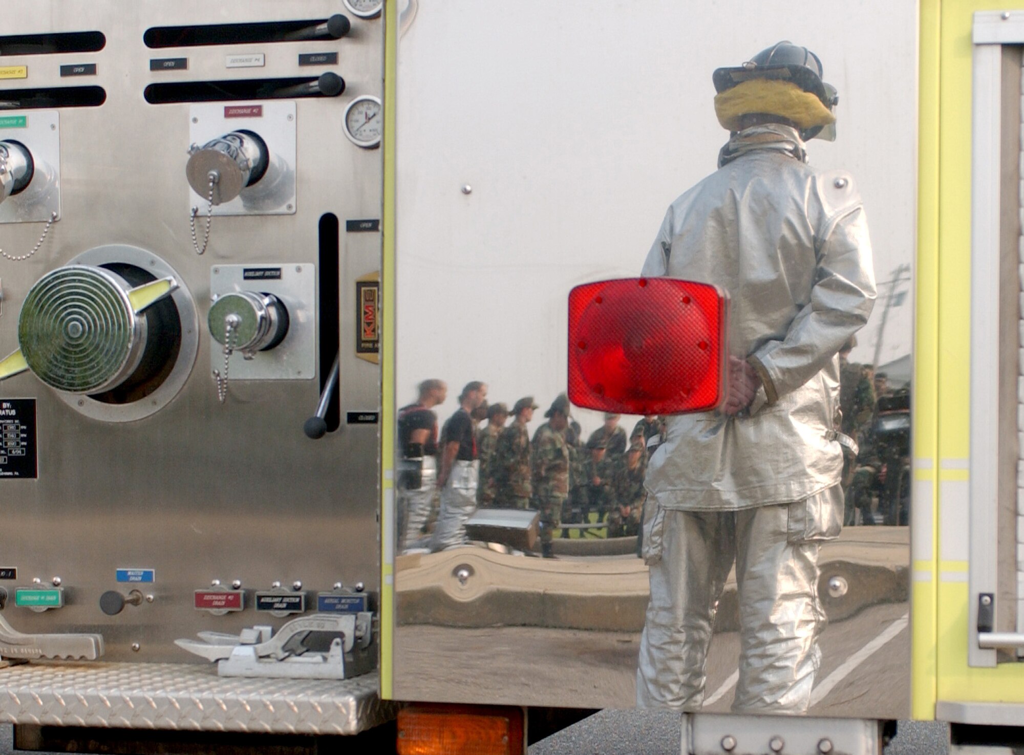 KUNSAN AIR BASE, South Korea – Tech. Sgt. Jeremy Pickett, a firefighter with the 8th Civil Engineer Squadron, waits to ring the fire station bell during the Sept. 11, 2001 remembrance ceremony here Tuesday.  The ceremony marked the 6th anniversary of the terrorist attacks in New York City, the Pentagon and Shanksville, Pa. (U.S. Air Force photo/Senior Airman Steven R. Doty)