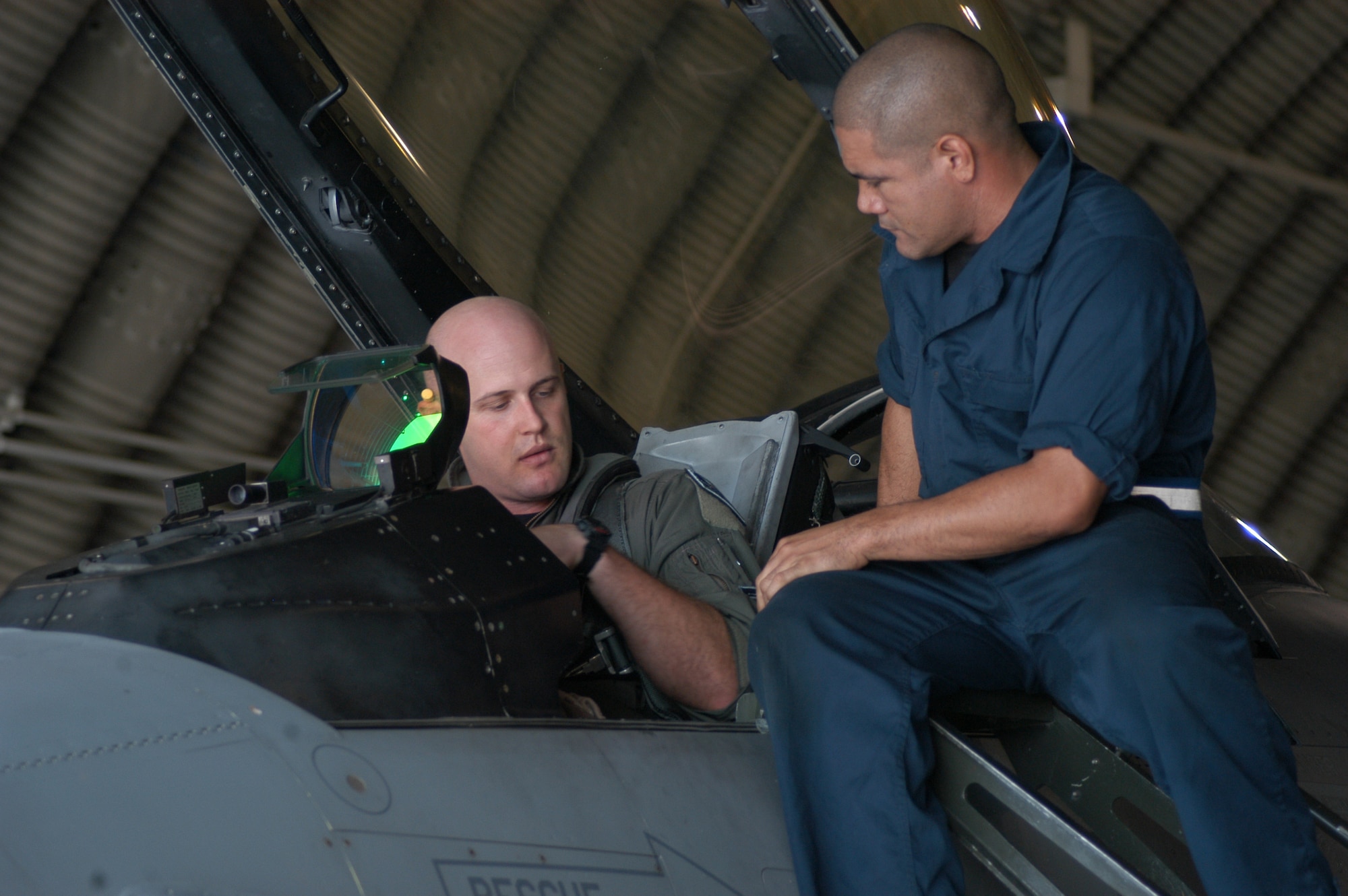 KUNSAN AIR BASE, South Korea— Capt. Dave Anderson and Staff Sgt. Tim Silva do a pre-flight inspection Sept 10. Captain Anderson received the Distinguished flying cross for his actions in support of Operation Iraqi Freedom. Captain Anderson is a flight commander for the 35th Fighter Squadron and Sergeant Silva is a crew chief for the 35th Aircraft Maintenance Unit. (U.S. Air Force photo/Staff Sgt. Araceli Alarcon)                                                              