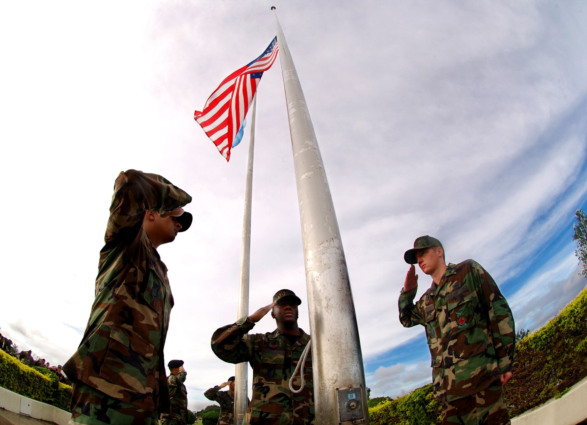 Kadena Airmen salute the American flag during Taps at the 9/11 memorial ceremony near the wing building on Kadena AB, Japan, Sept. 11.
(U.S. Air Force photo/Tech. Sgt. Reynaldo Ramon)

