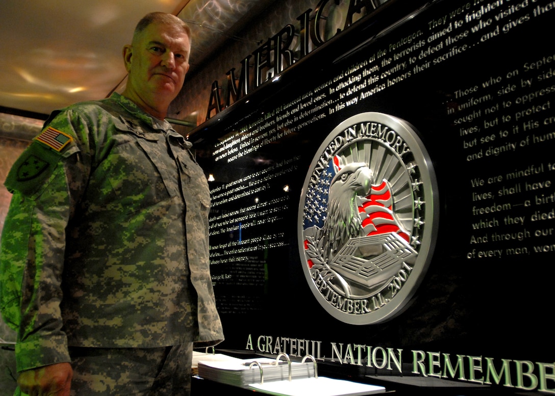 Army Chaplain (Col.) William Broome stands in the memorial chapel at the Pentagon. The chaplain helped minister to victims of the terrorist attacks there and is now the Pentagon Chaplain in charge of all religion support there. Defense dept. photo by Petty Officer 2nd Class Molly A. Burgess, U.S. Navy