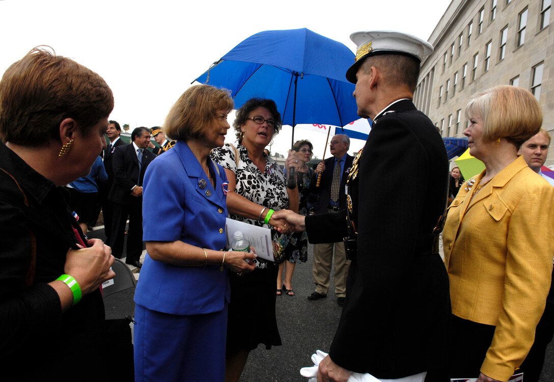 U.S. Marine Gen. Peter Pace, chairman of the Joint Chiefs of Staff, and his wife Lynne, meet with family members during a Sept. 11, 2001 remembrance and wreath laying ceremony at the Pentagon, Sept. 11, 2007.