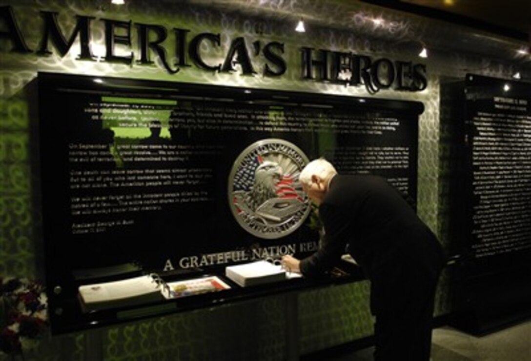 Defense Secretary Robert M. Gates signs the guest book at the Pentagon chapel prior to attending a Sept. 11, 2001 remembrance and wreath laying ceremony at the Pentagon, Sept. 11, 2007. 