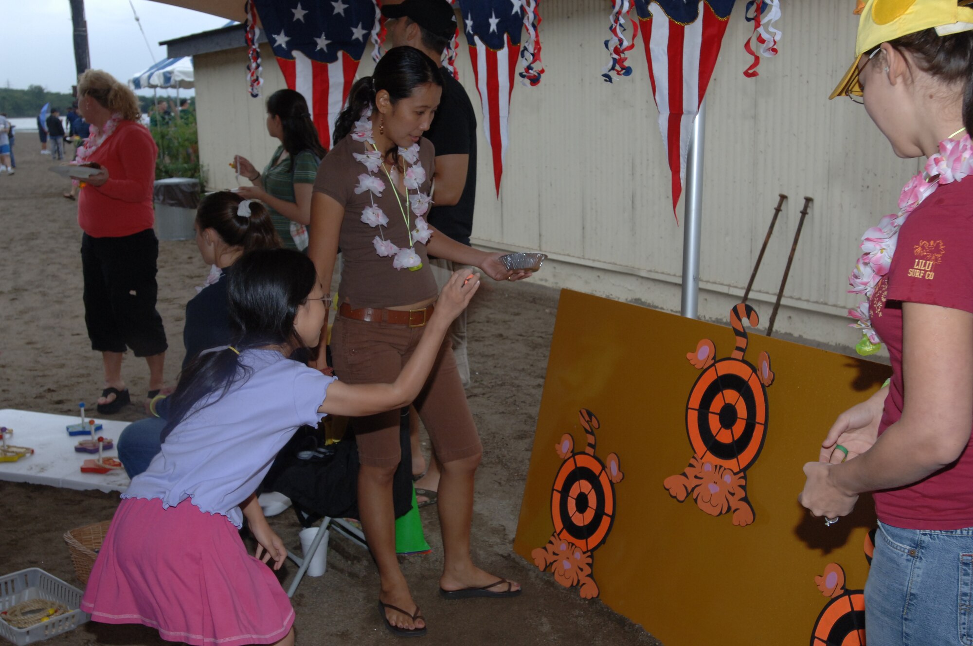 Children take a shot at catching some ducks at the Beach Bash here August 31, 2007. The Beach Bash included a number of children's games and activities, as well as the first Survivor Challenge, where 14 teams competed for top prize. 