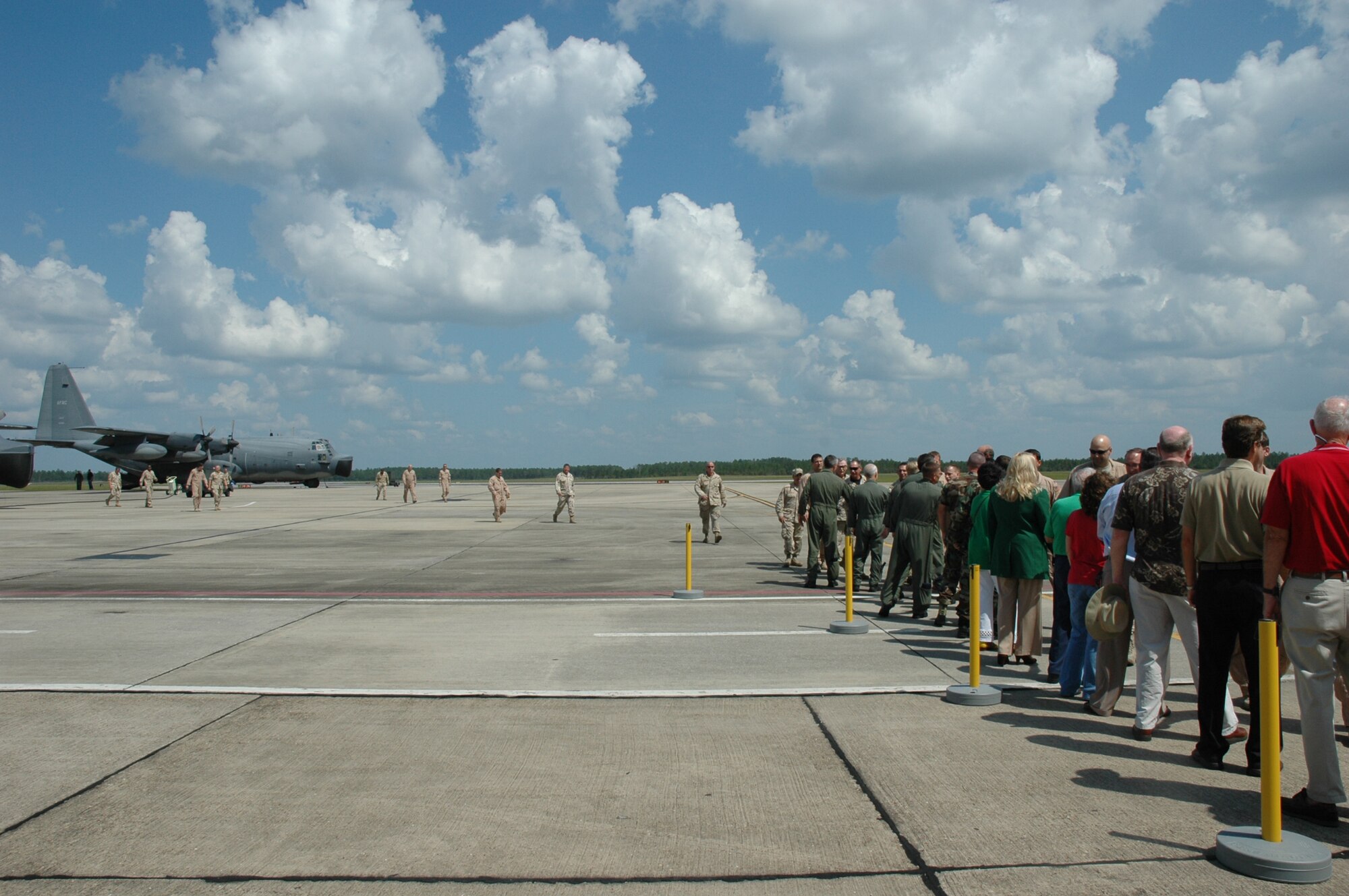 919th Special Operations Wing members are greeted by commanders and area supporters shortly after they landed on Duke Field Sept. 7. Forty Airmen returned from Southwest Asia. (U.S. Air Force Photo\Jasmine DeNamur)