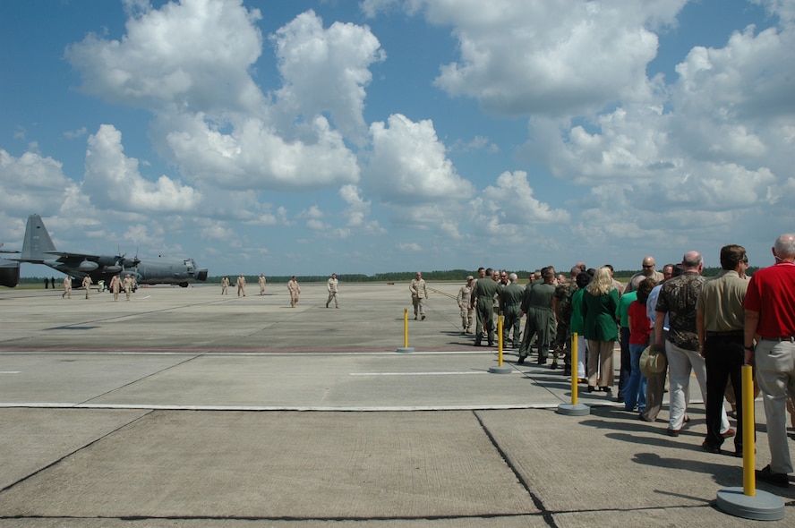 919th Special Operations Wing members are greeted by commanders and area supporters shortly after they landed on Duke Field Sept. 7. Forty Airmen returned from Southwest Asia. (U.S. Air Force Photo\Jasmine DeNamur)
