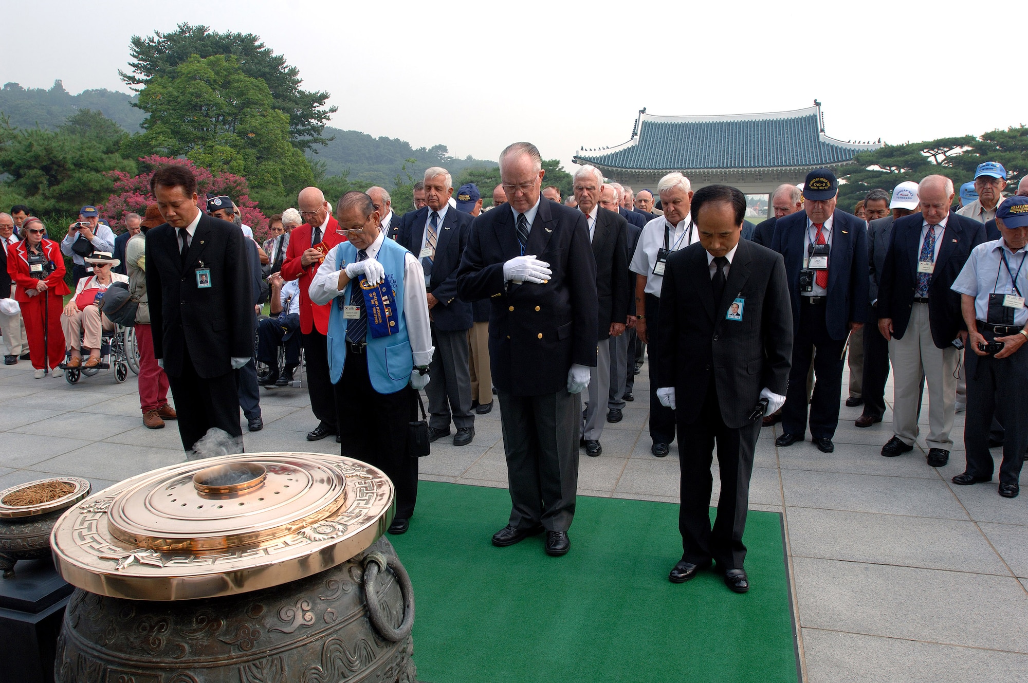 More than 200 Korean War veterans and family members pay respect to the men and women lost during the war with a moment of silence during a ceremony at the South Korean National Cemetery Sept. 12. The South Korean government's Revisit Korea program invites war veterans each year to come to South Korea to honor the men and woman from 21 countries who served during the Korean War. Nearly 25,000 veterans have participated in this program since 1975. (U.S. Air Force photo/Staff Sgt. Bennie J. Davis III) 
