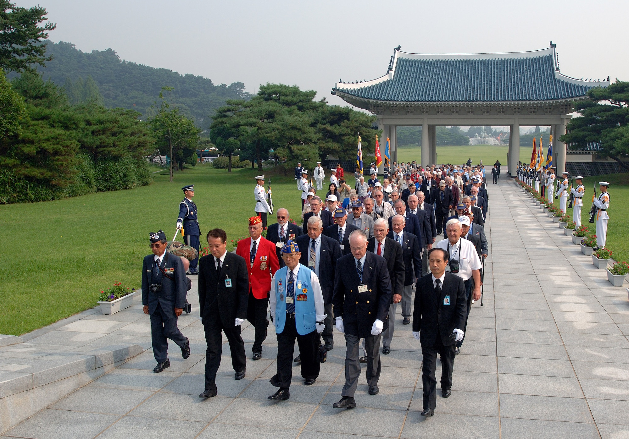 Retired Maj. Gen. Carl G. Schneider and retired Philippines Gen. Vic Azada lead more than 200 Korean War veterans for a wreath-laying ceremony at the South Korean National Cemetery along with fellow Korean War veterans Sept. 12. The South Korean government's Revisit Korea program invites war veterans each year to come to South Korea to honor the men and woman from 21 countries who served during the Korean War. Nearly 25,000 veterans have participated in this program since 1975. (U.S. Air Force photo/Staff Sgt. Bennie J. Davis III) 

