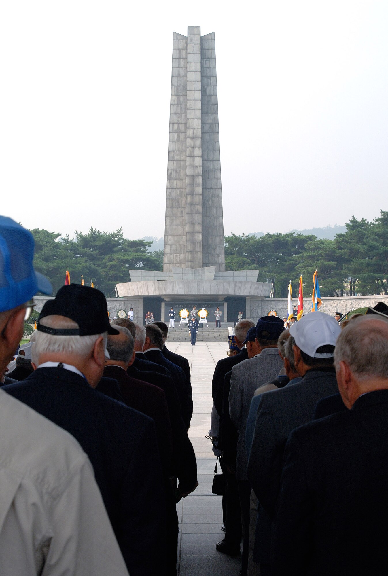 Korean War veterans prepare for a wreath-laying ceremony at the South Korean National Cemetery Sept. 12. The South Korean government's Revisit Korea program invites war veterans each year to come to South Korea to honor the men and woman from 21 different countries who served during the Korean War. Nearly 25,000 veterans have participated in this program since 1975. (U.S. Air Force photo/Staff Sgt. Bennie J. Davis III) 
