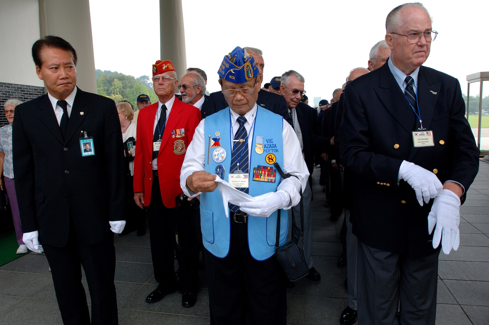 Retired Maj. Gen. Carl G. Schneider (right) and retired Philippines Gen. Vic Azada (center) prepare for a wreath-laying ceremony at the South Korean National Cemetery along with fellow Korean War veterans Sept. 12. The South Korean government's Revisit Korea program invites war veterans each year to come to South Korea to honor the men and woman from 21 countries who served during the Korean War. Nearly 25,000 veterans have participated in this program since 1975. (U.S. Air Force photo/Staff Sgt. Bennie J. Davis III) 
